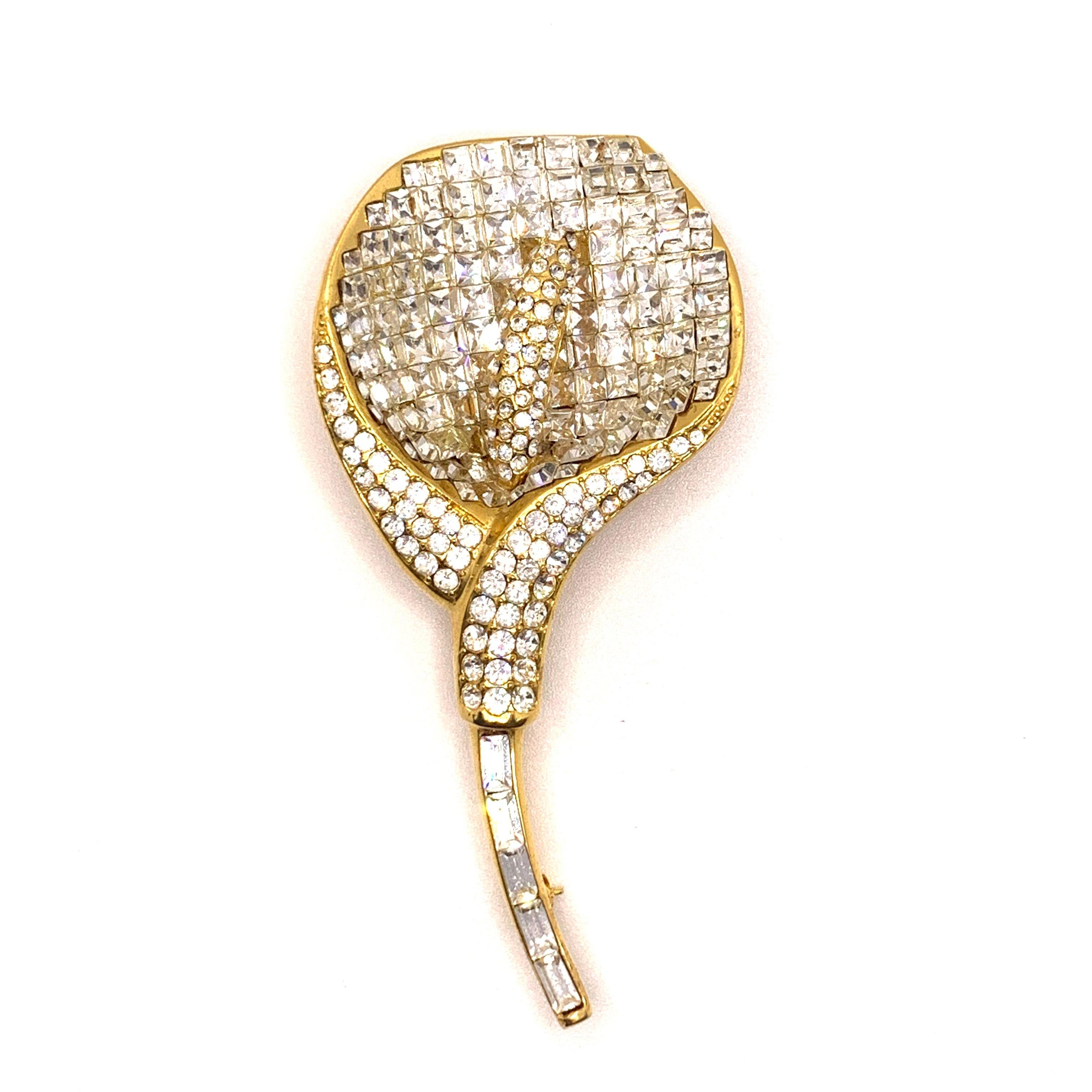 Classic Elegant Vintage Swarovski Clear Crystal Calla Lily Brooch

This vintage brooch features over 240 pieces of white Swarovski crystals in yellow gold tone. Made in the USA by New York designer brand Jarin.  3