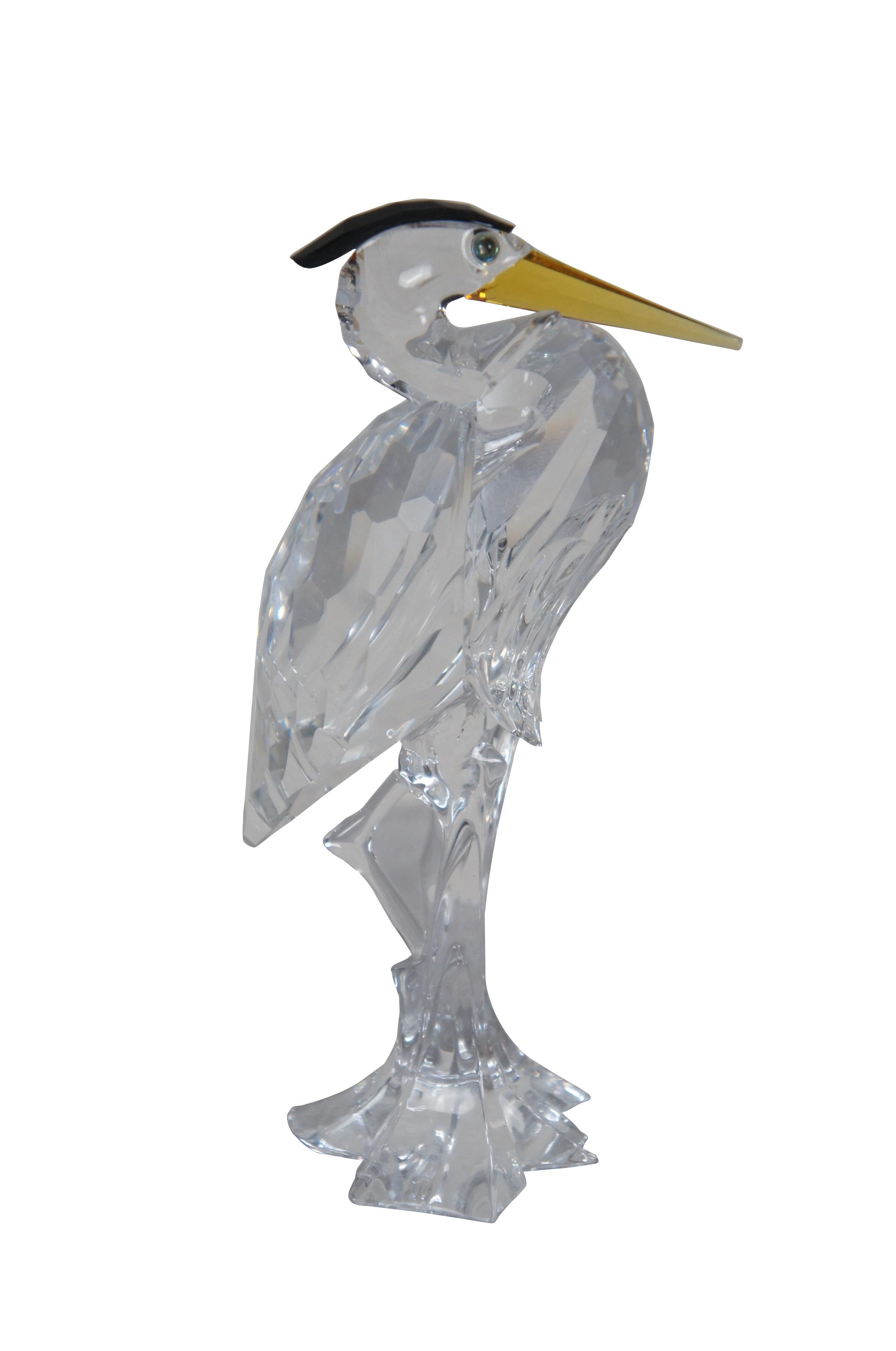 Vintage retired Swarovski Crystal figurine in the shape of a Silver Heron with black crest and yellow beak.

Dimensions:
2.75