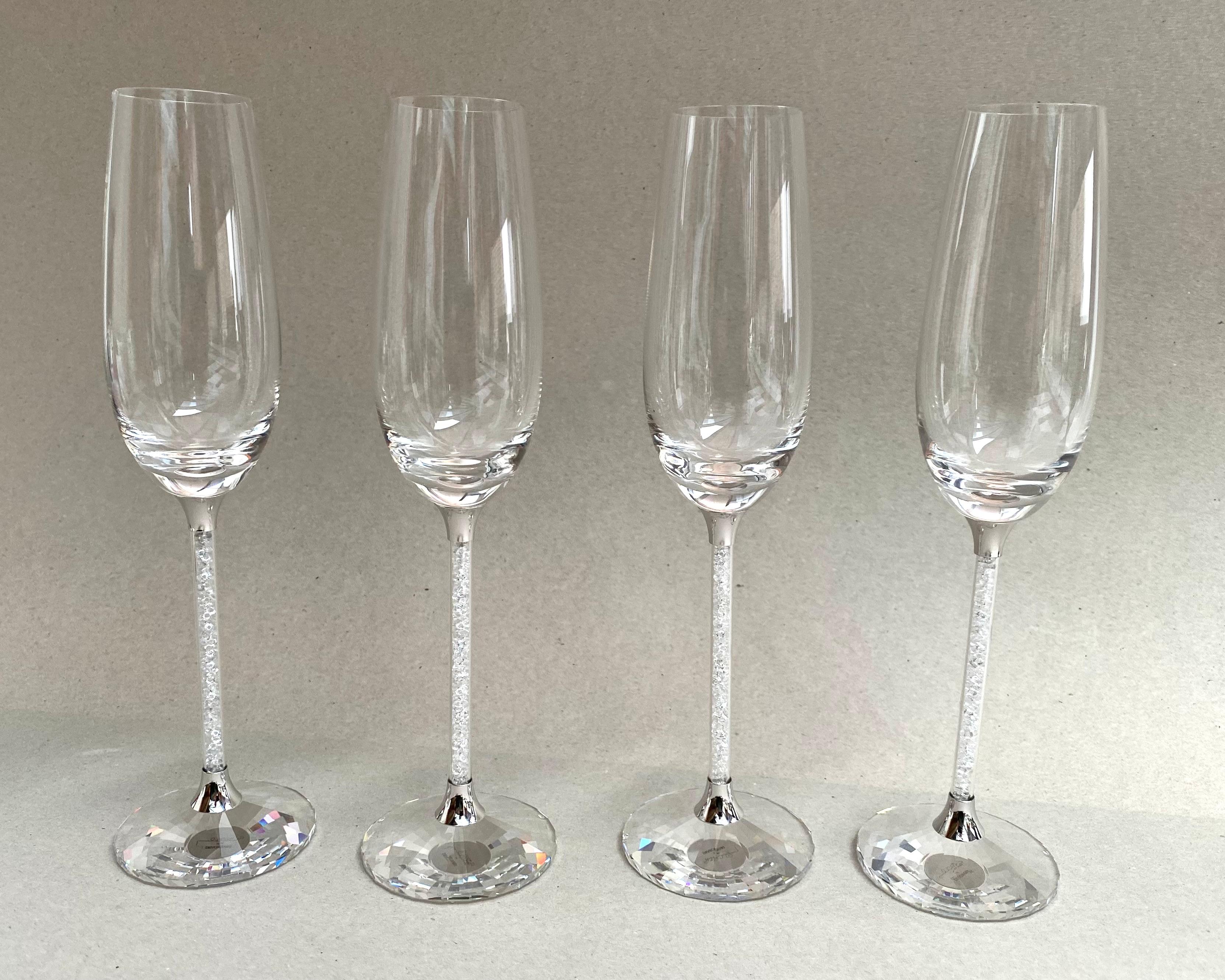 Vintage Swarovski Crystal Toasting Flutes designed by the renowned Steven Weinberg and crafted for those special moments that deserve to be celebrated in style.

These are not merely champagne flutes; they are heirlooms, imbued with the history and