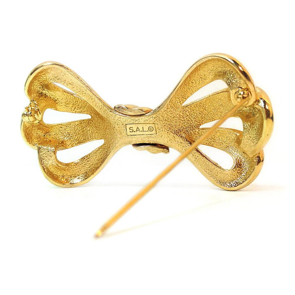Modern Vintage Swarovski Golden Bow Brooch For Sale