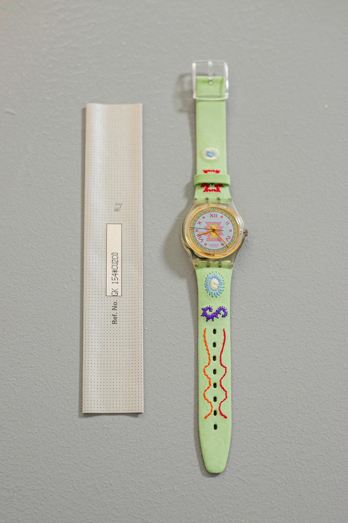 Vintage Swatch watch from the 1993 collection. Country and romantic design watch, along the strap there are colored embroideries with abstract figures, the skin is a delicate pastel green color perfect to combine with an embroidered day maxi dress.