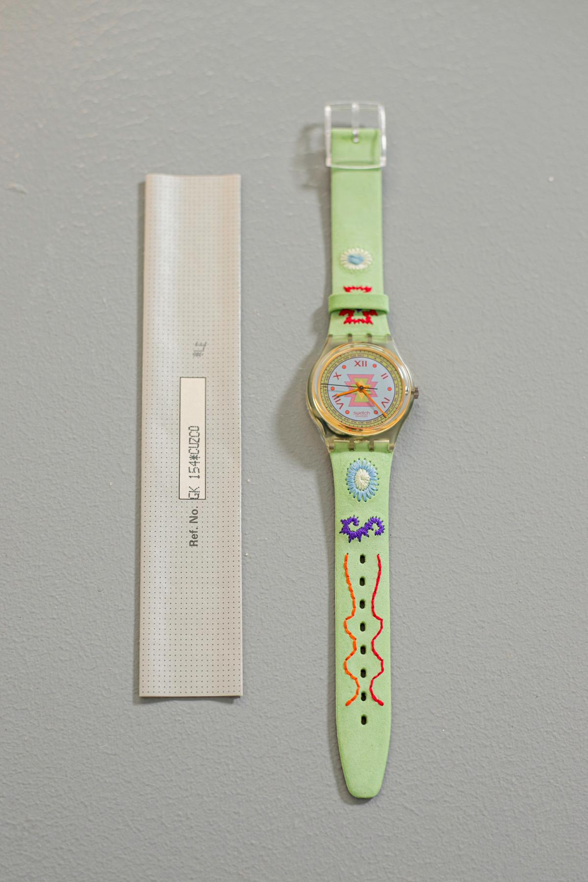 Vintage Swatch watch from the 1993 collection. Country and romantic design watch, along the strap there are colored embroideries with abstract figures, the skin is a delicate pastel green color perfect to combine with an embroidered day maxi dress.