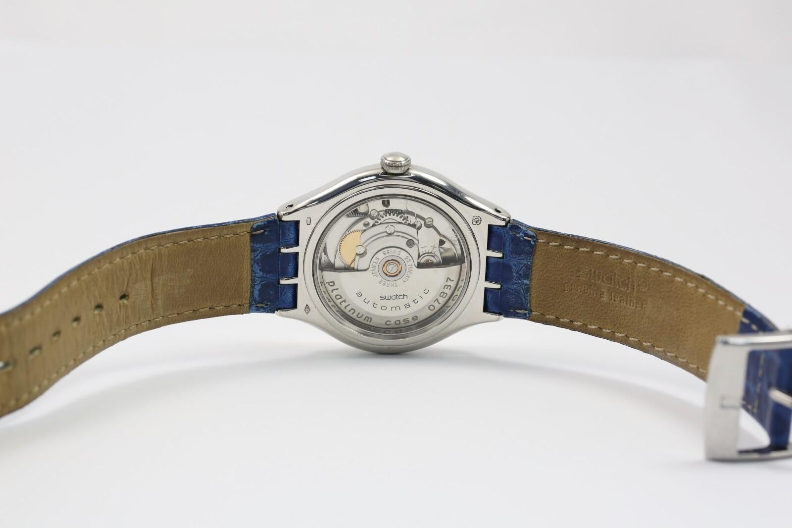 Reloj Swatch Vintage Tresor Magique Platino con estuche de presentación en venta 5