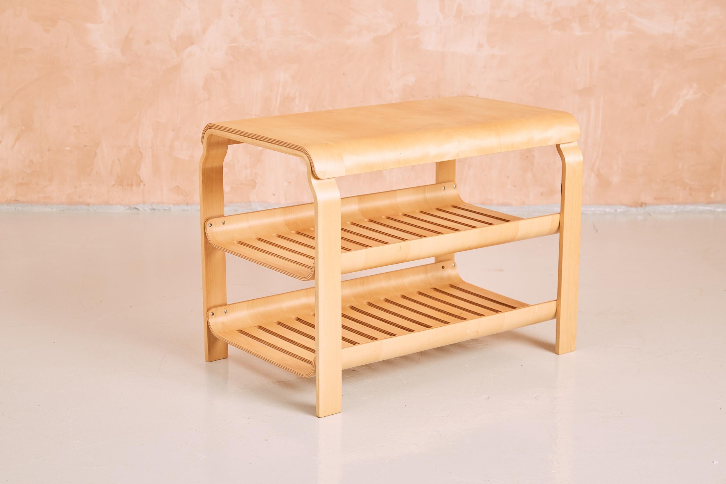 Excellent example of 80's Swedish design, utilising bent birch ply with its crisp golden tone and smooth finish. An elegant piece that incorporates two lower tiers that are softened with scooped edges and a slatted surface. The delightful felicitous