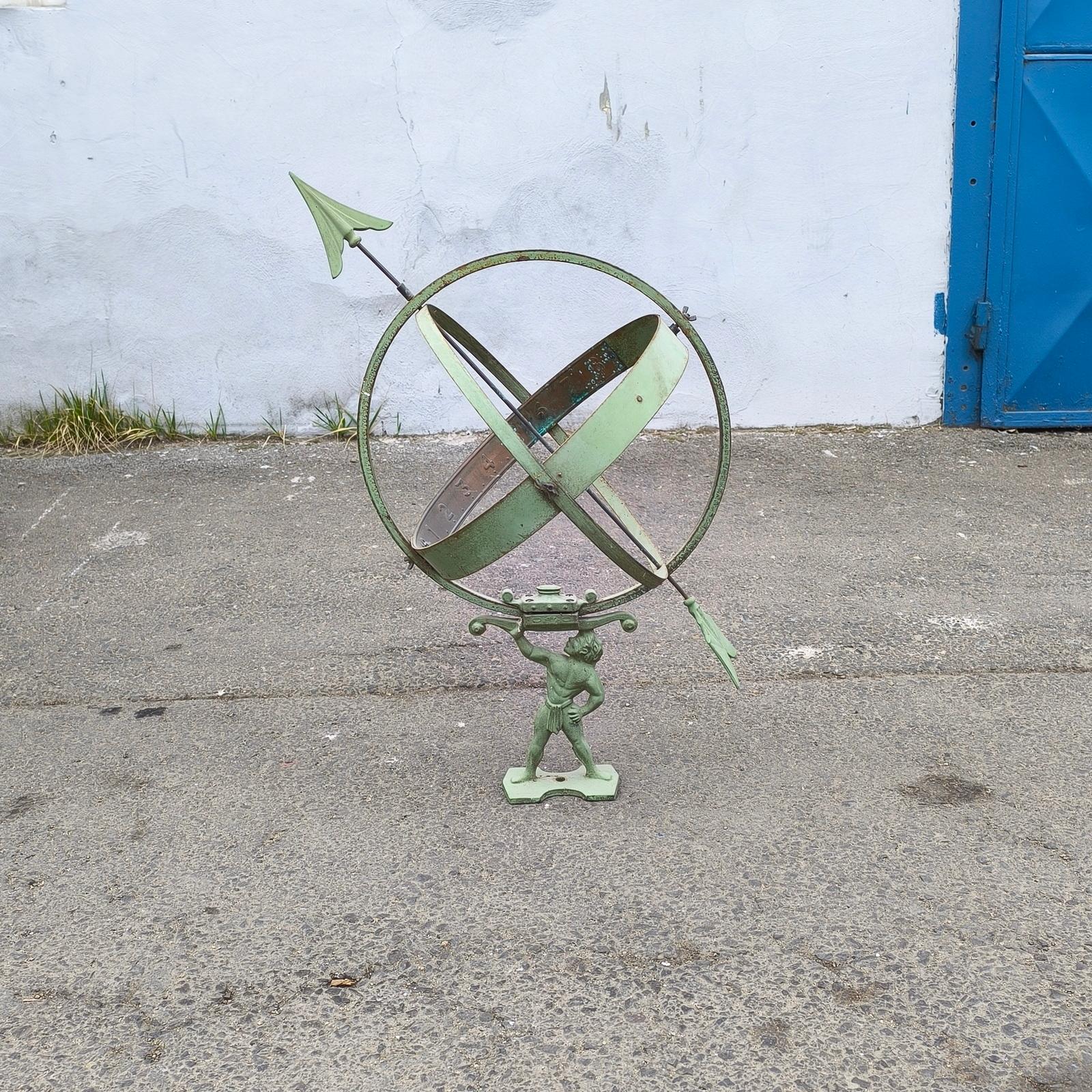 Vintage Original Sun Clock or Armillary Sun Dial attributed to Sune Rooth, mid-20th century.
Antique garden ornament from Sweden, known as a Sun Clock or Armillary Sun dial, with a cast metal figure holding spherical rings, that can be mounted on a