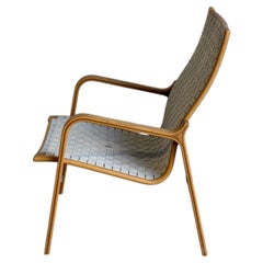 Sillón sueco vintage de madera curvada con asiento de malla, estilo Mid-Century Modern, de los años 70