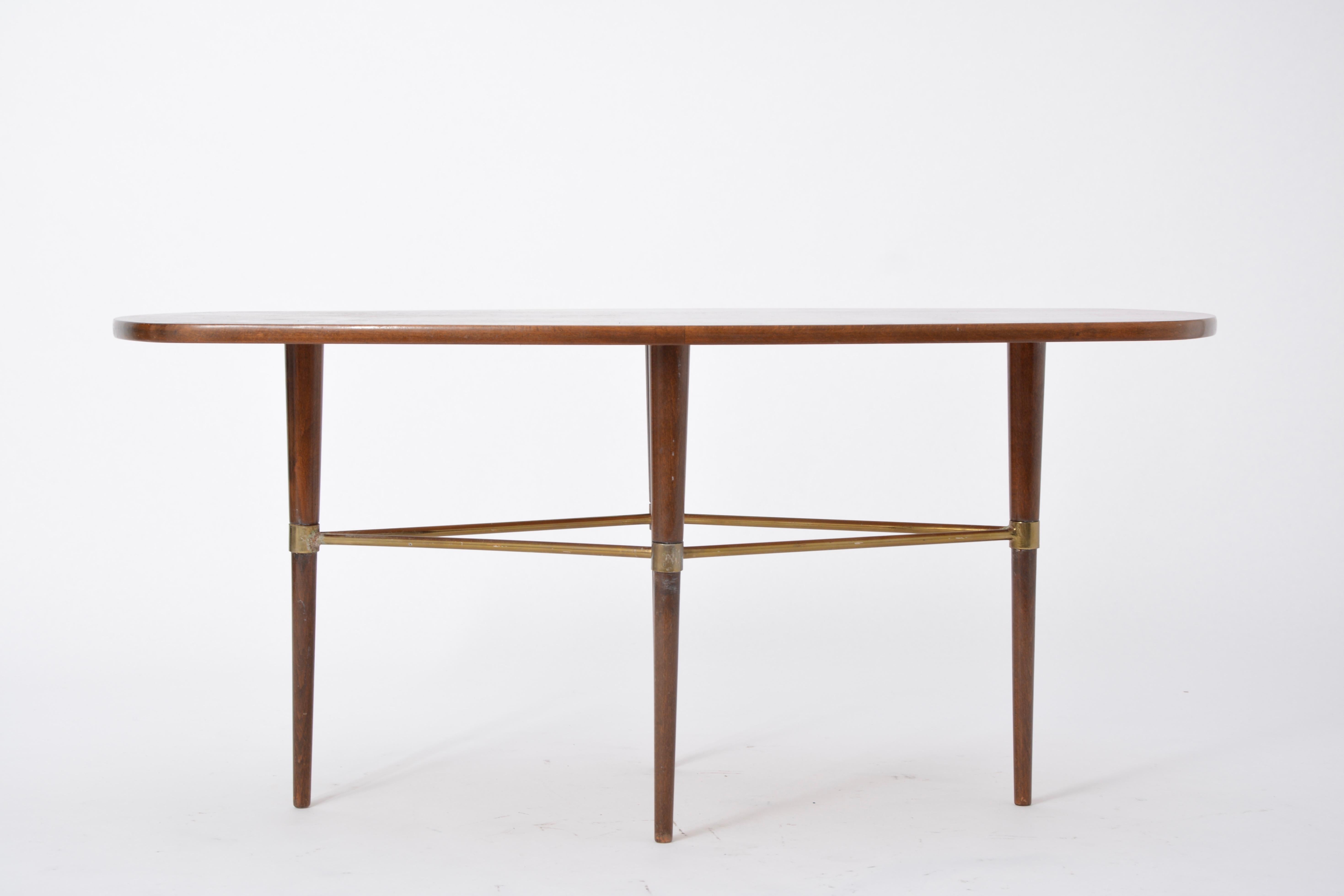 Swedish Mid-Century Modern coffee table by Förenades Möbler

This coffee table was produced by the Swedish company Förenade Möbler in the 1950s. The table top features beautiful wood veneer, and the legs a wood structure with brass detailing. The