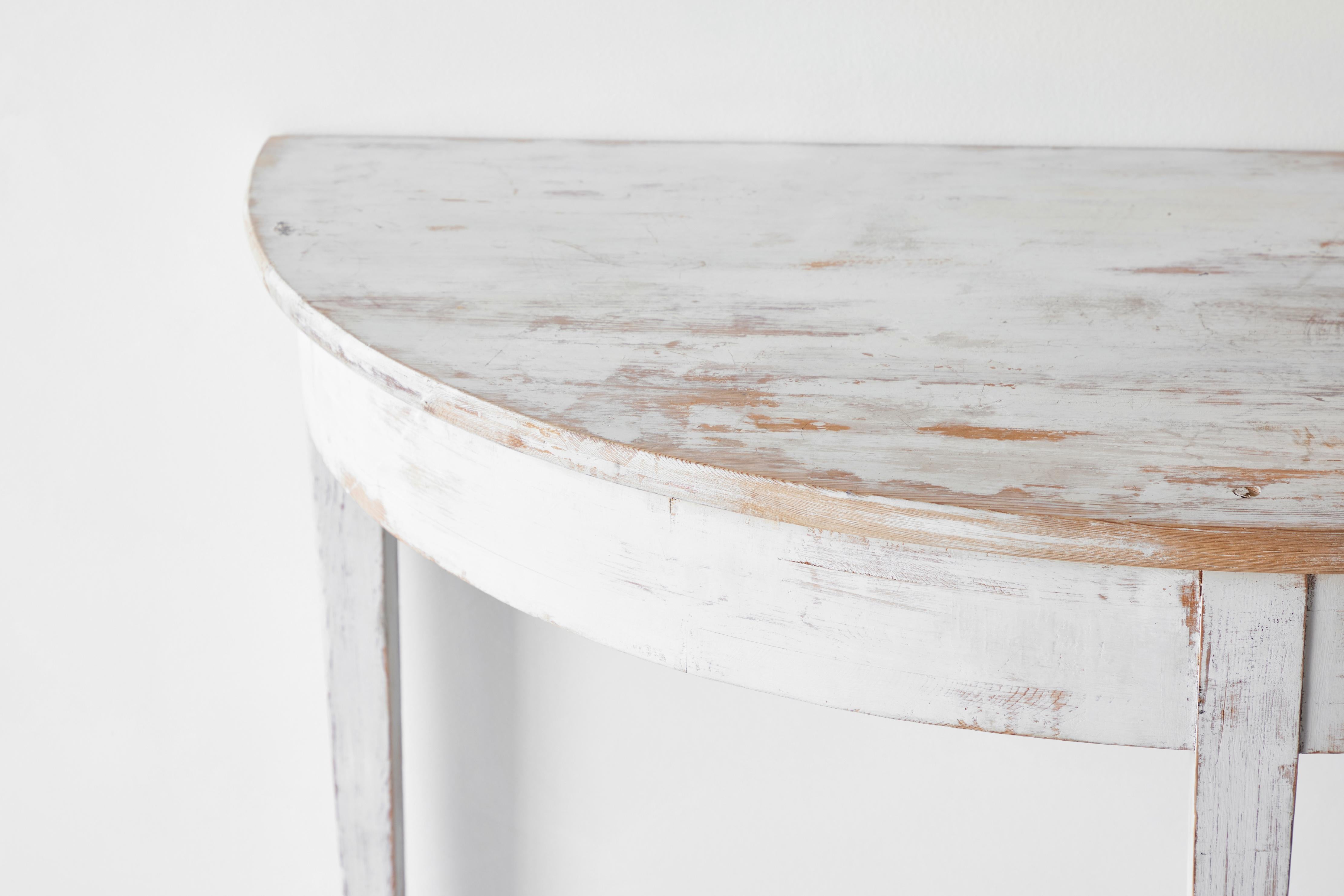 Rustic white Swedish demilune table from the early 20th century.
 