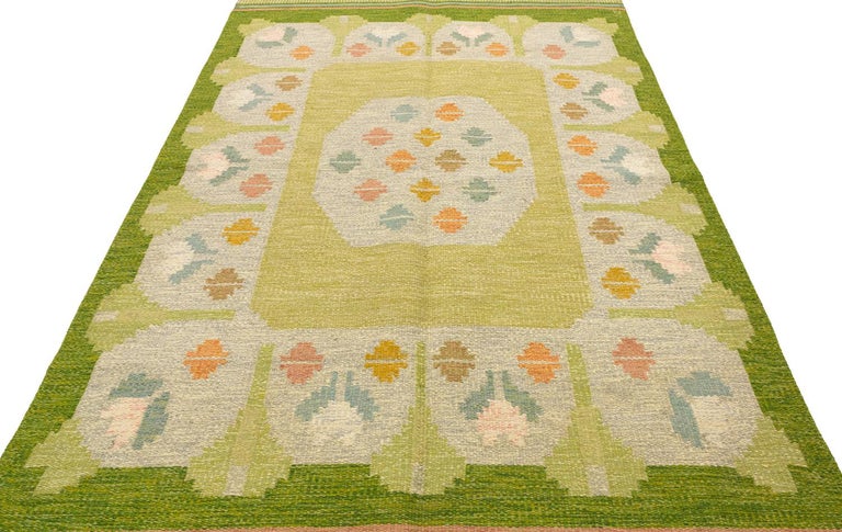 This is a semi-antique Swedish kilim woven circa 1950 and it measures 237 X 165 cm. It bares initial of OA (Anna Joanna Angstrom) with a fresh and delightful color palette. An elegant and attractive piece.