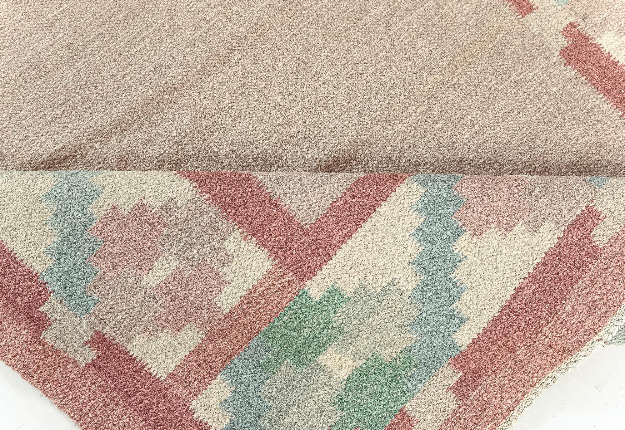 Vintage Swedish beige, green, pink flat weave rug.
Size: 6'3