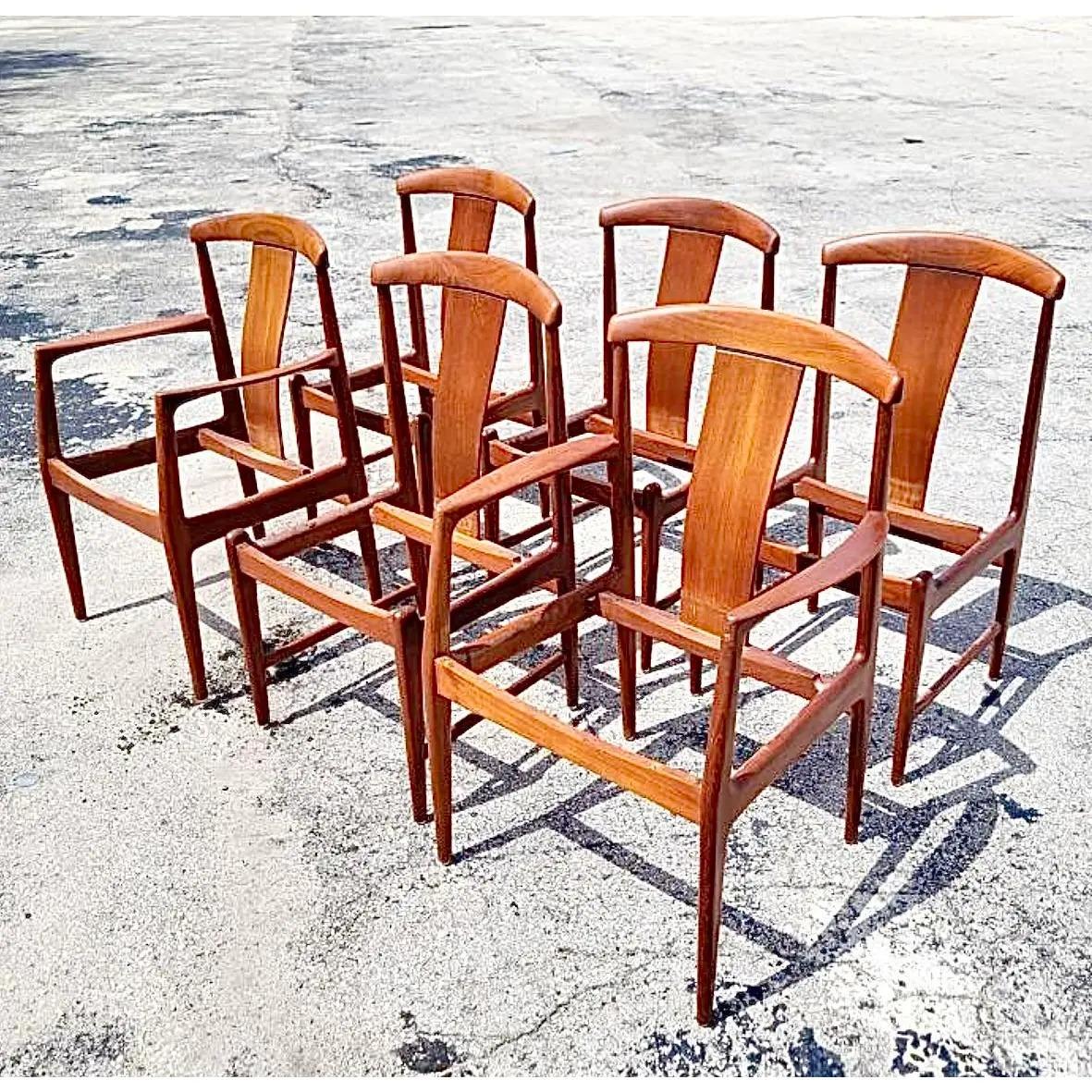 A fabulous set of 6 vintage Swedish MCM dining chairs. Beautiful clean shape in a polished teak frame. Seats are included in this purchase. Unmarked, but matching table is marked. Matching table also available. Acquired from a Palm Beach estate.