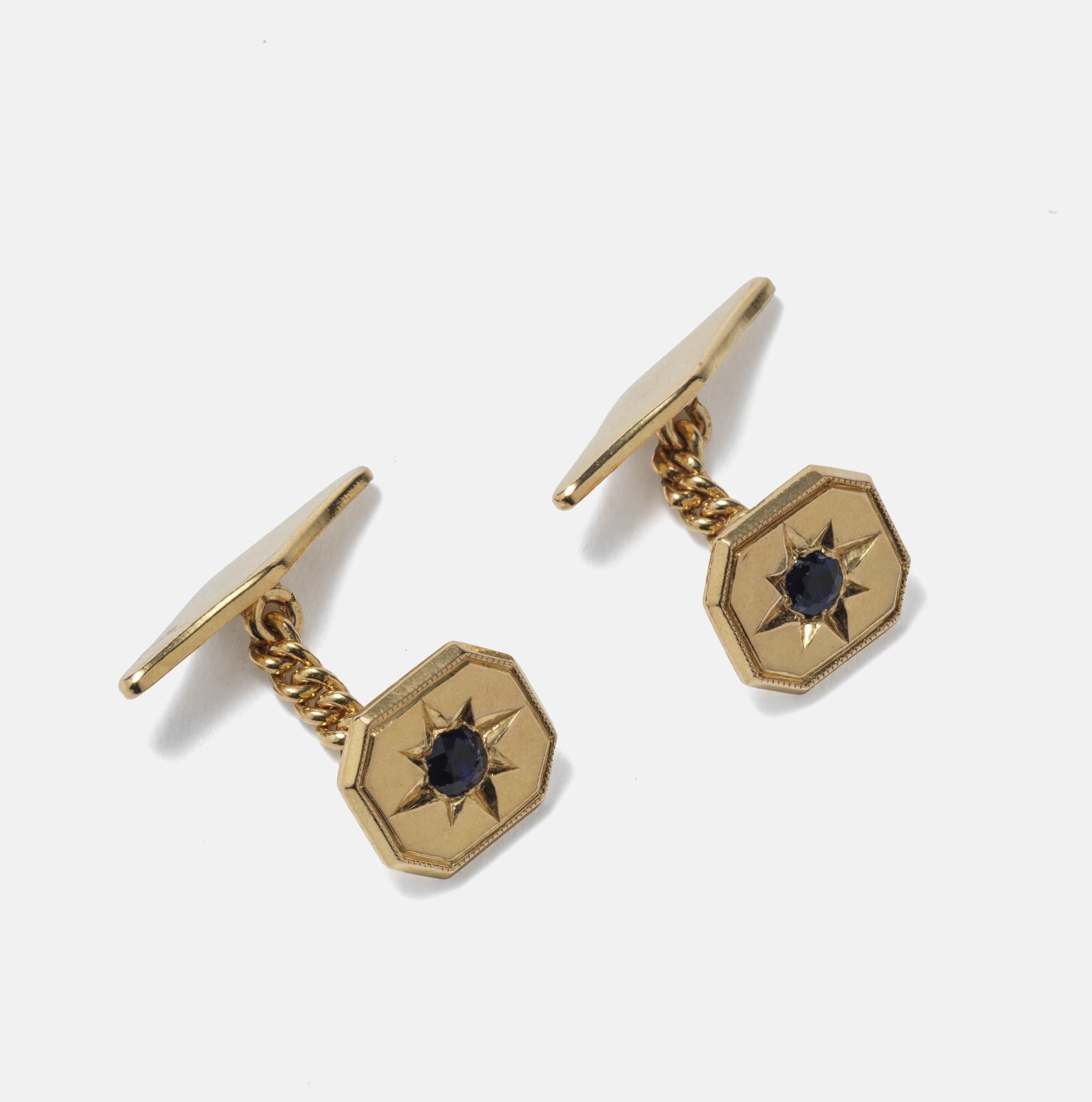 These octagonal gold cufflinks are adorned with small blue stones. They were made by the Swedish smith Sven Svan (worked 1964-1978) who was based in the north of Sweden.