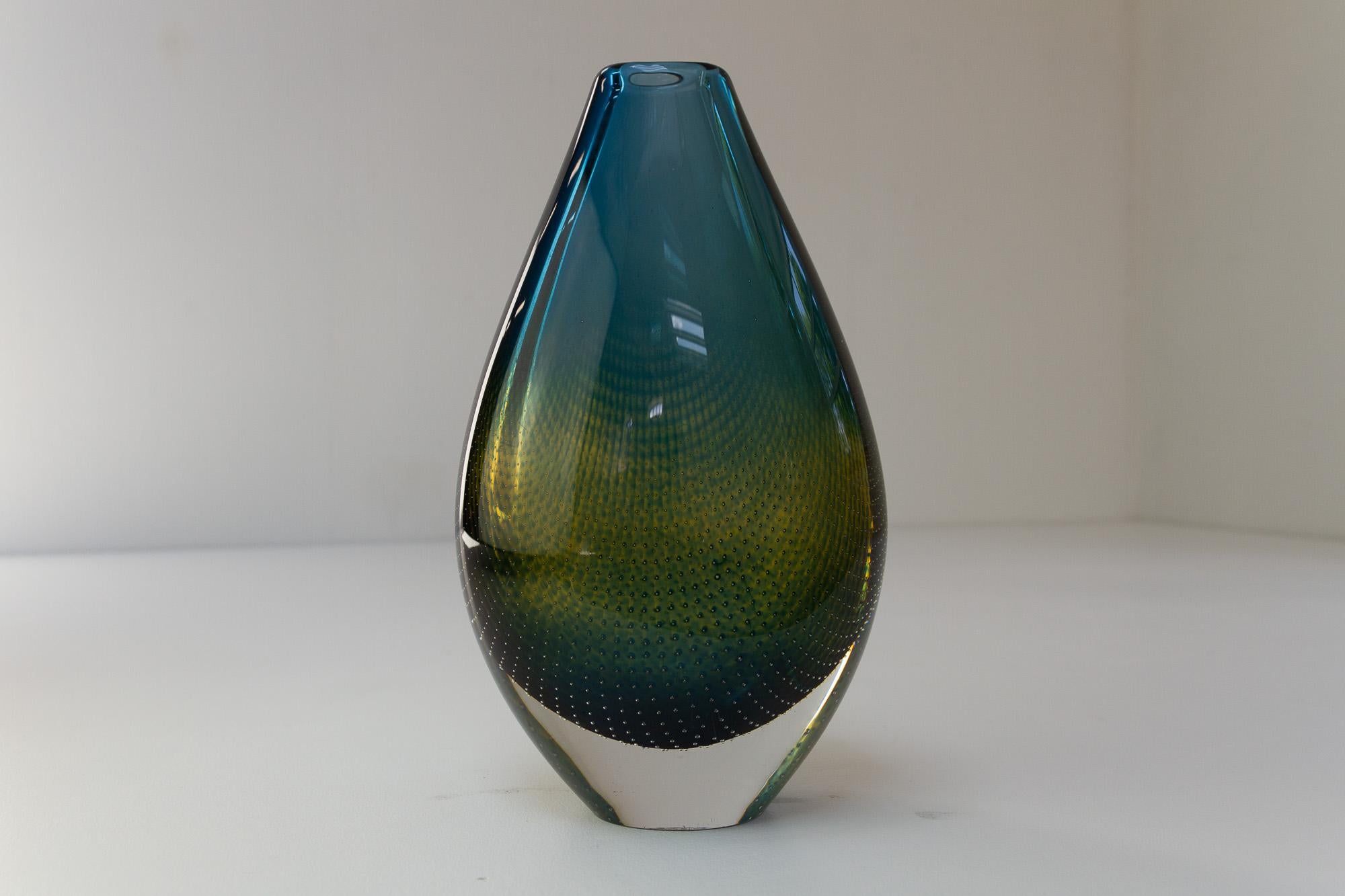 Vintage Swedish Kraka Glass Vase by Sven Palmqvist for Orrefors, Sweden  1960s.
Tear shaped hand blown clear glass vase with blue and green curved net pattern (fish net) with tiny inlaid air bubbles.
Engraved on the bottom: 