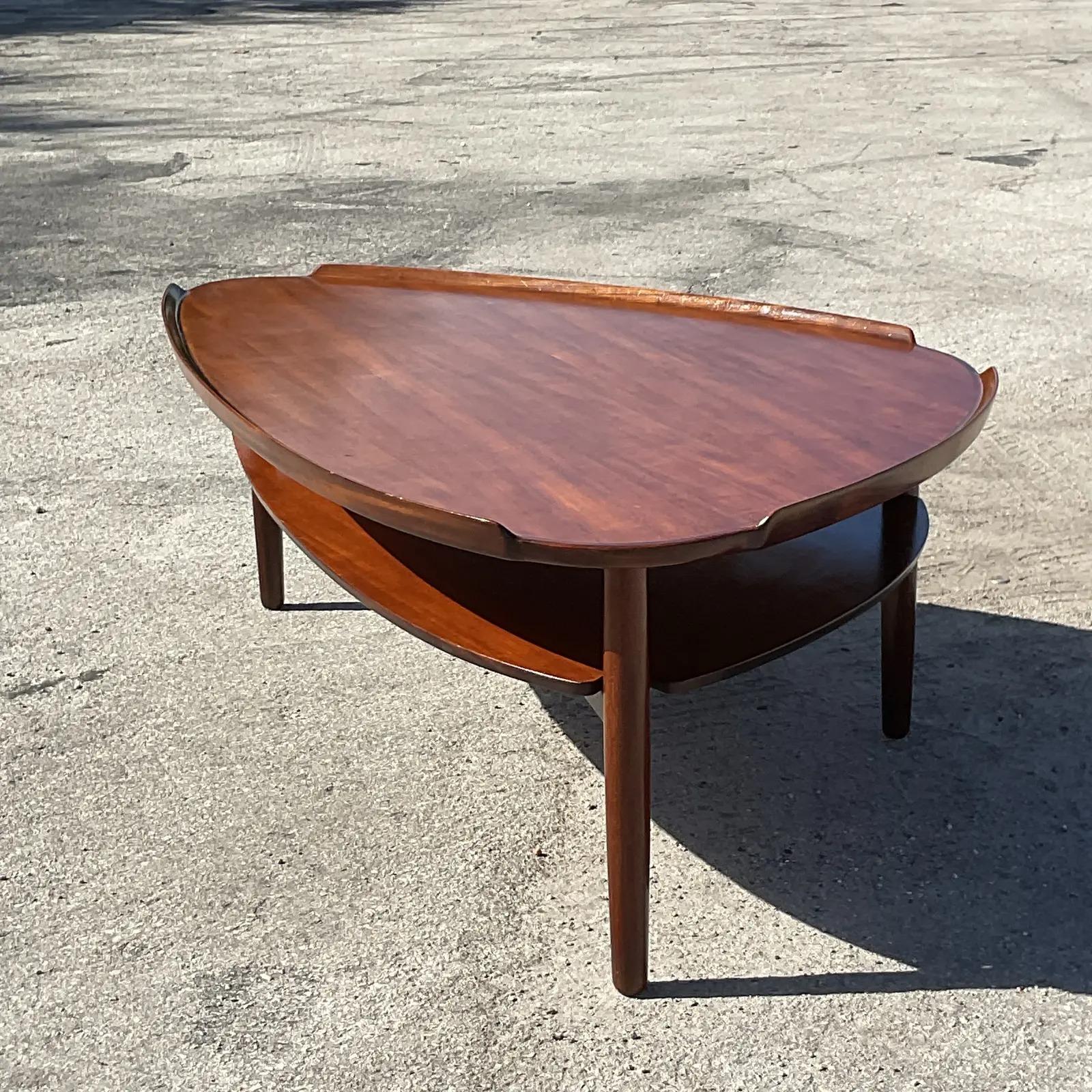 Vintage MCM coffee table. Made by the iconic Yngve Ekstrom for Mobler Sweden. Beautiful biomorphic shape with a bi-level design. Tagged on the bottom. Acquired from a Palm Beach estate.