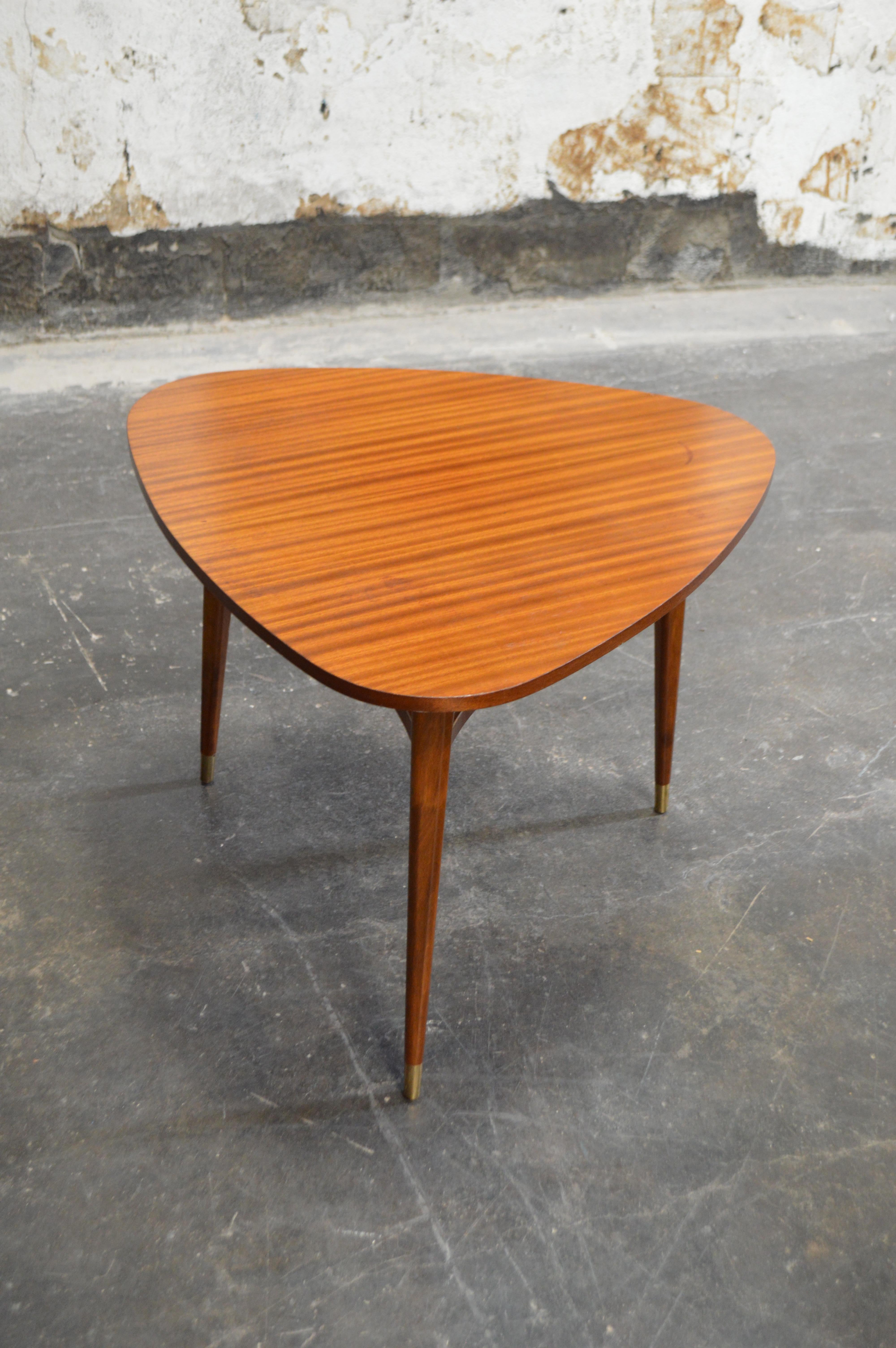 What a beauty! The perfect height and size side table for your sofa or a lounge chair, this tripod table features round tapered legs with brass sabots (some call them ferrule or caps, but doesn't sabot sound much more sophisticated?) and crafted of