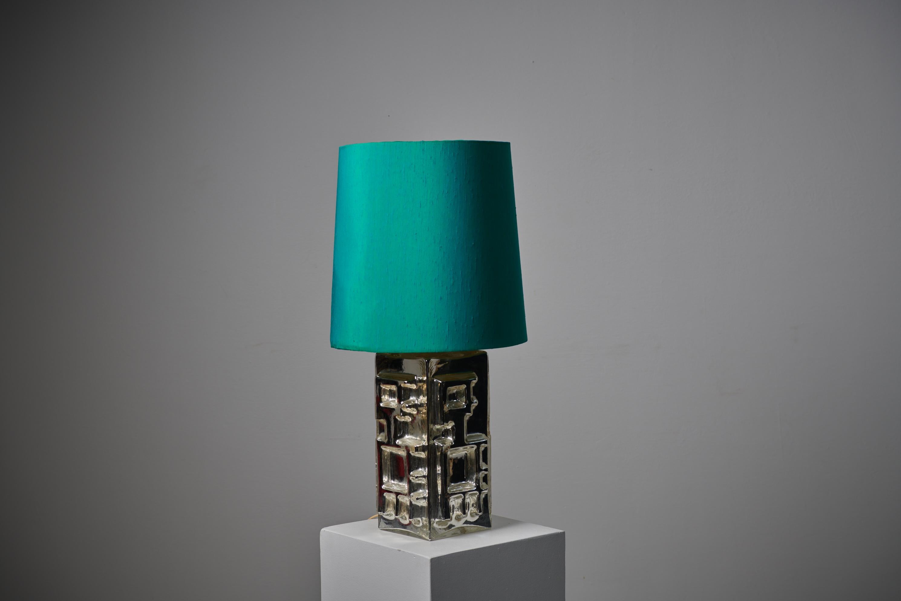 Vintage Swedish table lamp from the mid 20th century. Illuminate your space with the enchanting allure of this vintage Swedish table lamp, a captivating piece from the stylish 1960s! The lamp boasts a square glass foot adorned with a mesmerising