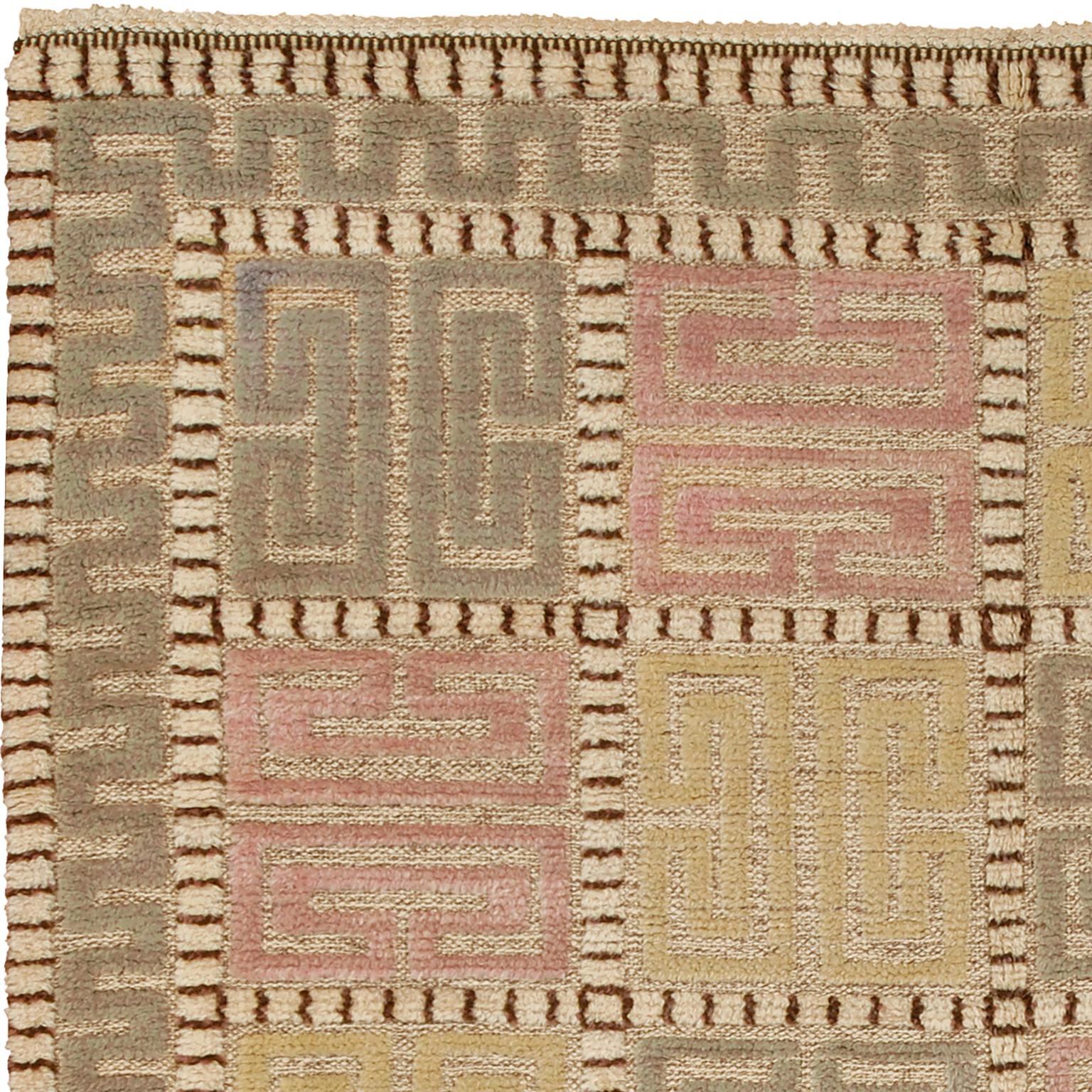 Sweden ca. 1940
Signed 'AB MMF' (Märta Måås-Fjetterström Workshop )
Handwoven with pile technique
Featuring a cream background, with yellow, pink and green pile motifs and a striped border.
7'1