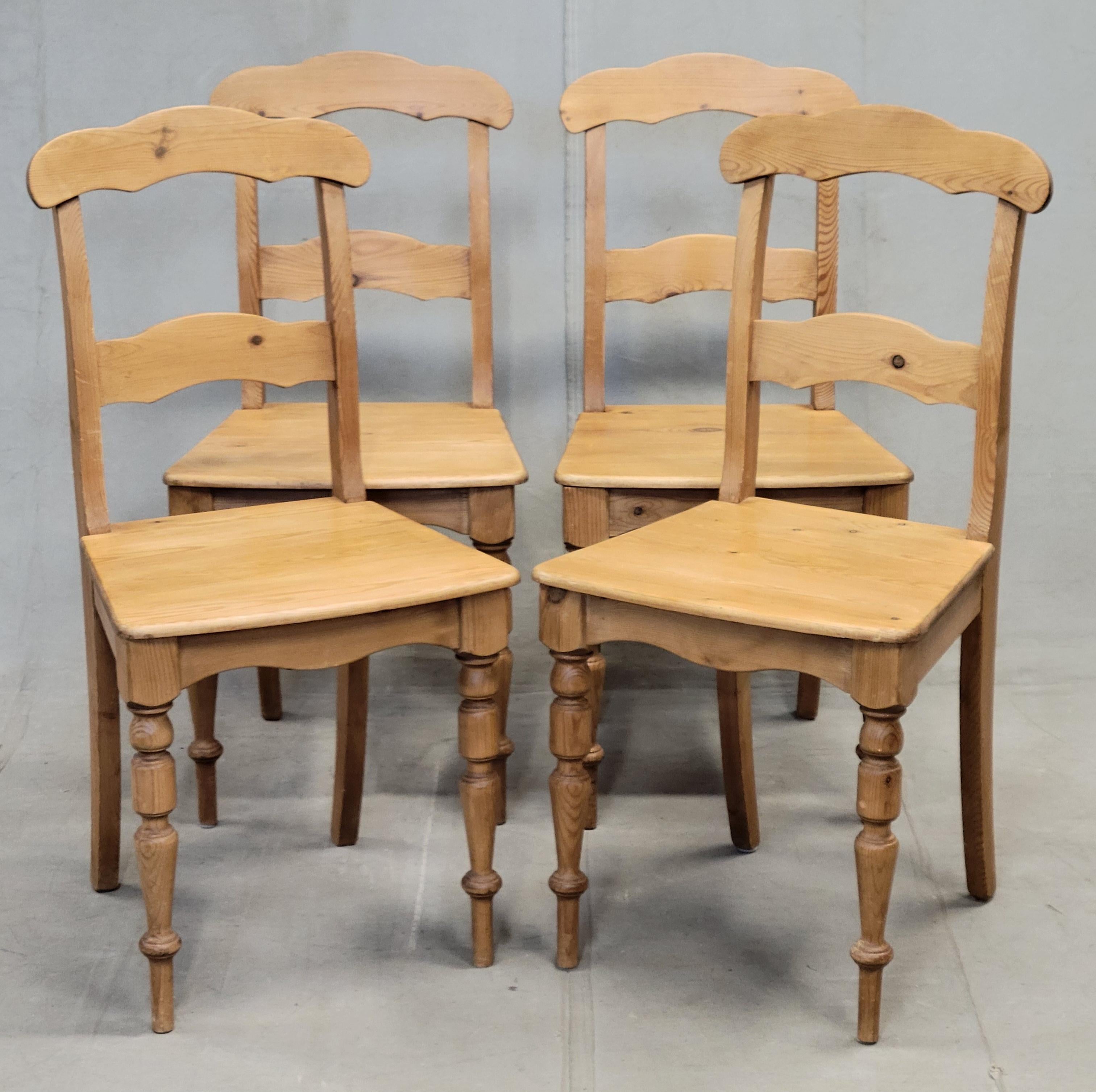 A charming set of six vintage Swedish waxed natural pine farmhouse style dining chairs. The turned legs, sculpted armrests and backrests give this set such character. Perfect for use with an antique natural pine farmhouse table. 
Side chairs measure