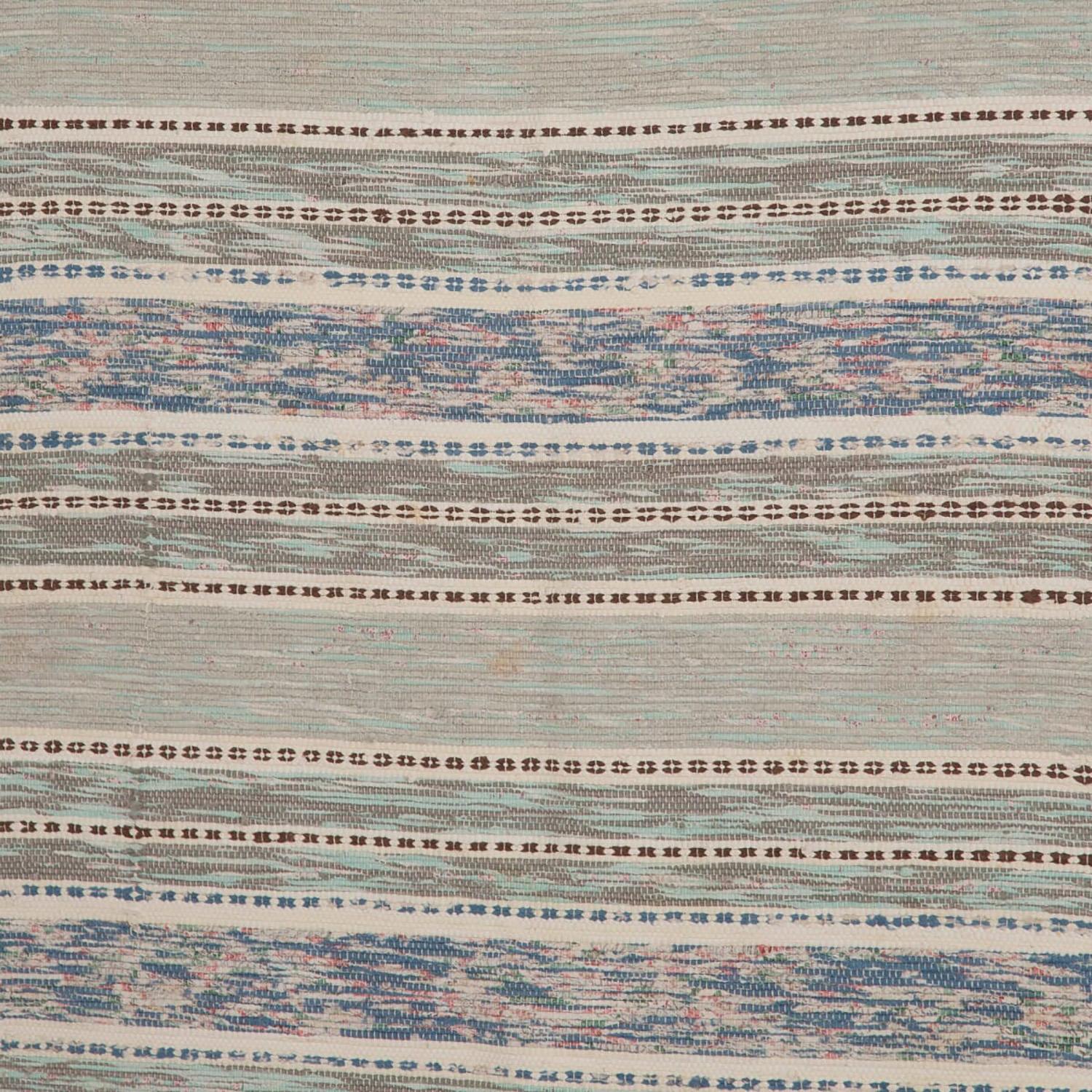 Vintage Swedish rug handwoven in the 1950s, with tones of light green and multi tone stripes.
 