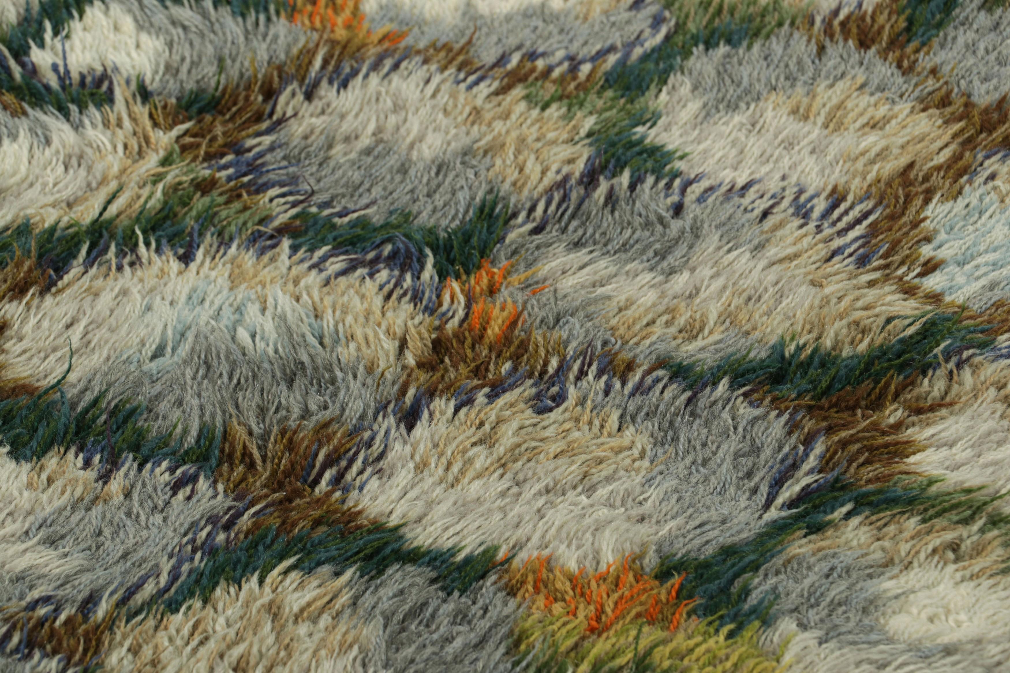 Hand-knotted in lush, high-pile wool in Sweden circa 1960-1970, this 3x5 vintage Swedish Rya rug is a bold new addition to Rug & Kilim’s curation of rare and collectible mid-century rugs of this provenance.

On the Design: 

Connoisseurs will
