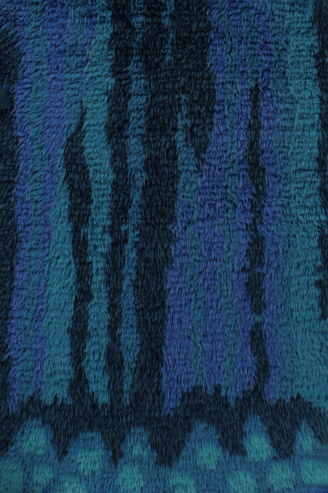  Hand-knotted in lush, high-pile wool in Sweden circa 1960-1970, this 4x6 vintage Swedish rya rug is a bold new addition to Rug & Kilim’s curation of iconic, one-of-a-kind mid-century Scandinavian rugs of this provenance. 

On the Design: 

Admirers