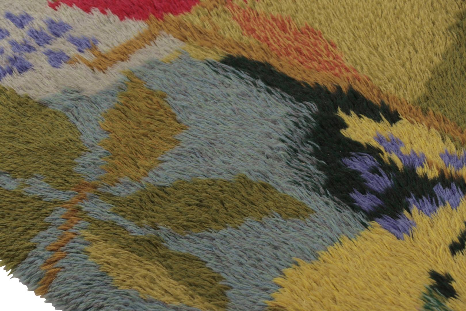  Hand-knotted in lush, high-pile wool in Sweden circa 1960-1970, this 3x5 vintage Swedish Rya rug in varied shades of green, and blue is a bold new addition to Rug & Kilim’s curation of iconic, one-of-a-kind mid-century Scandinavian rugs of this