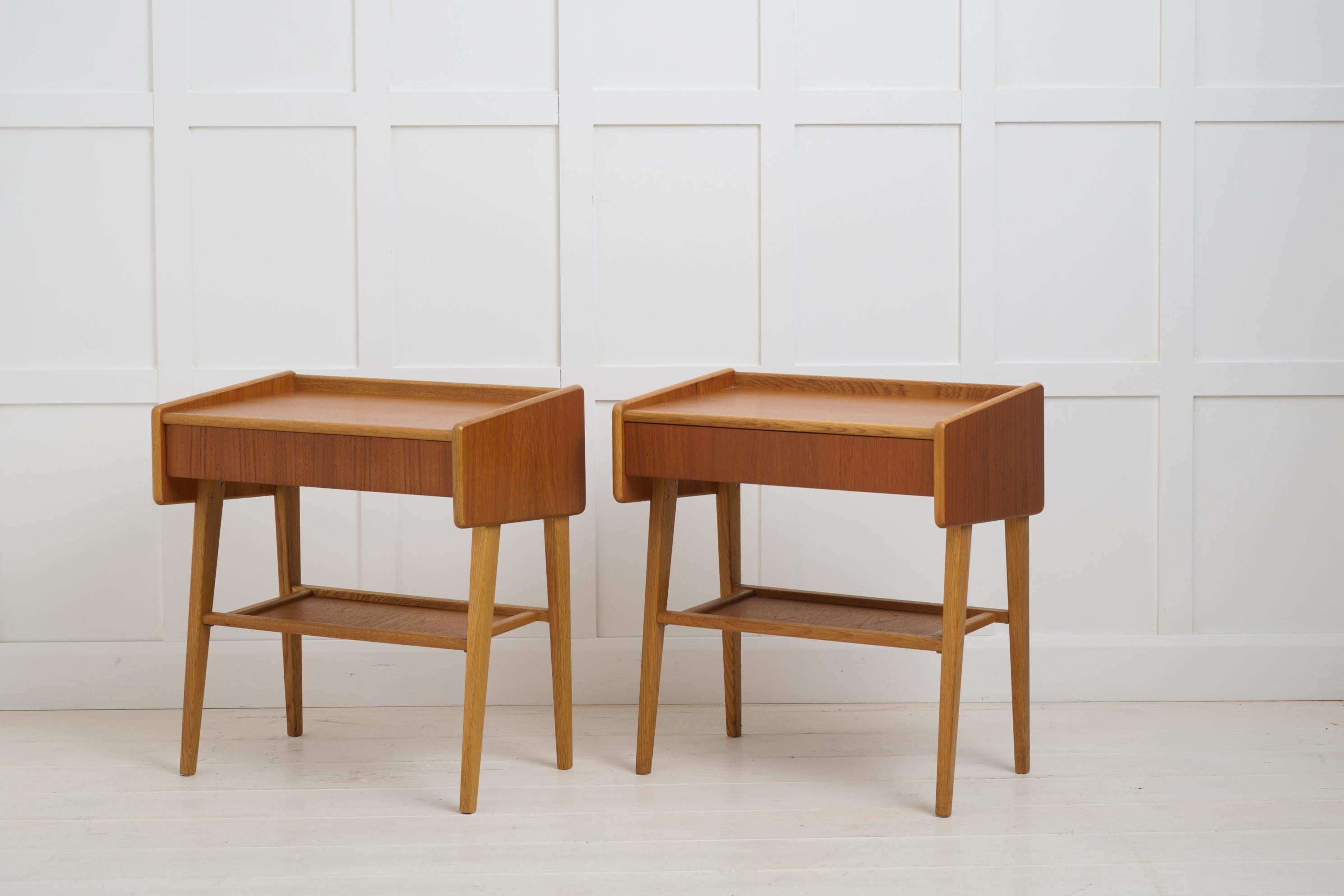 Vintage Scandinavian teak nightstands, with a single drawer and shelf underneath. The pair is made in Sweden around 1960. Good vintage condition with some minor traces and marks of use. The nightstands are 50 cm high and the short edge around the