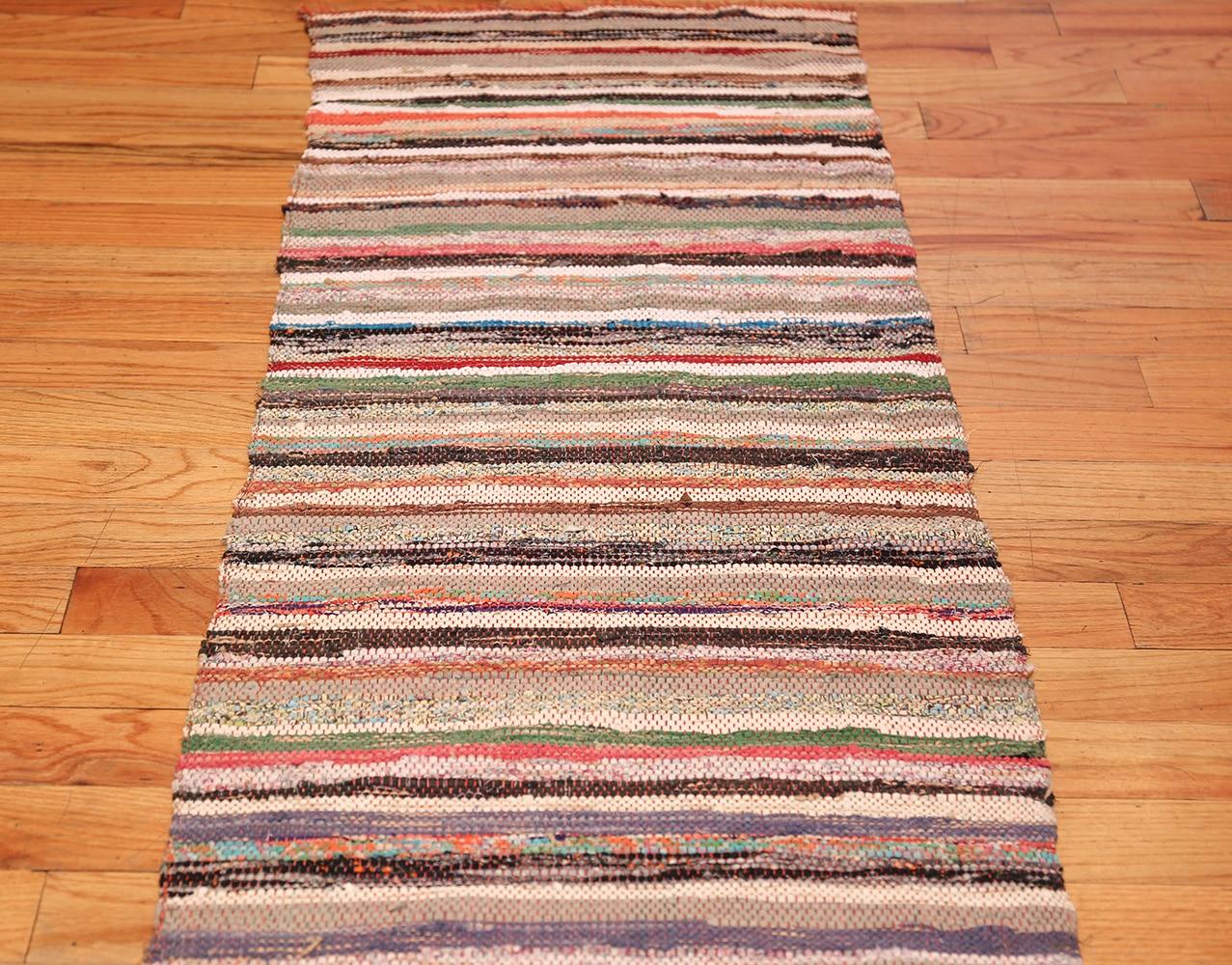 Vintage Swedish Scandinavian Runner rag rug, country of origin: Sweden, date circa mid-20th century. Size: 2 ft. x 6 ft. 4 in (0.61 m x 1.93 m). Bright color and a striking multihued abstract pattern ensure this delightful work is a bold and