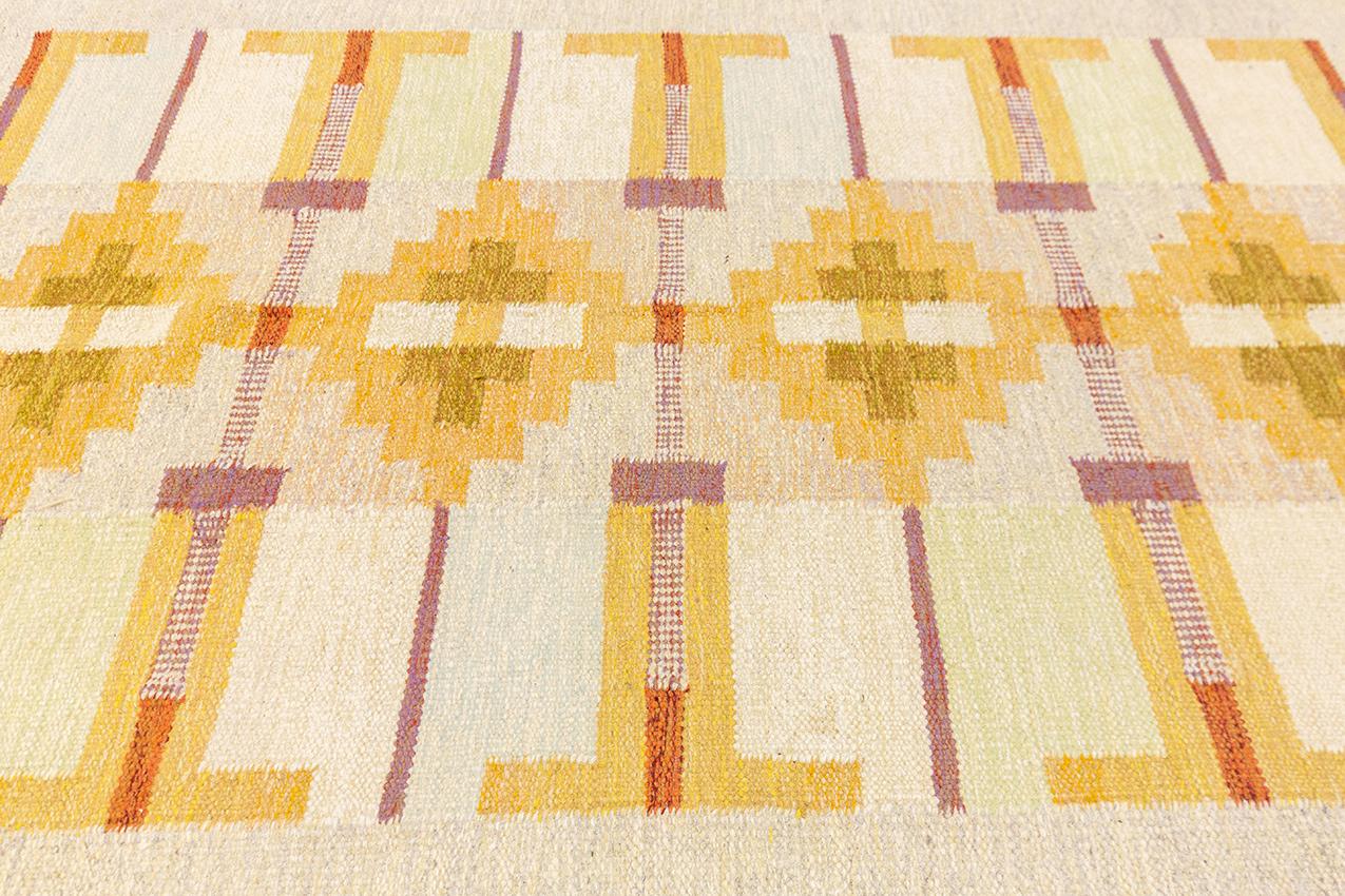 This Swedish kilim was woven in wool over cotton warp and weft by Karin Jonsson (KJ) between 1950 and 1970 measuring 222 × 168 cm (7' 3