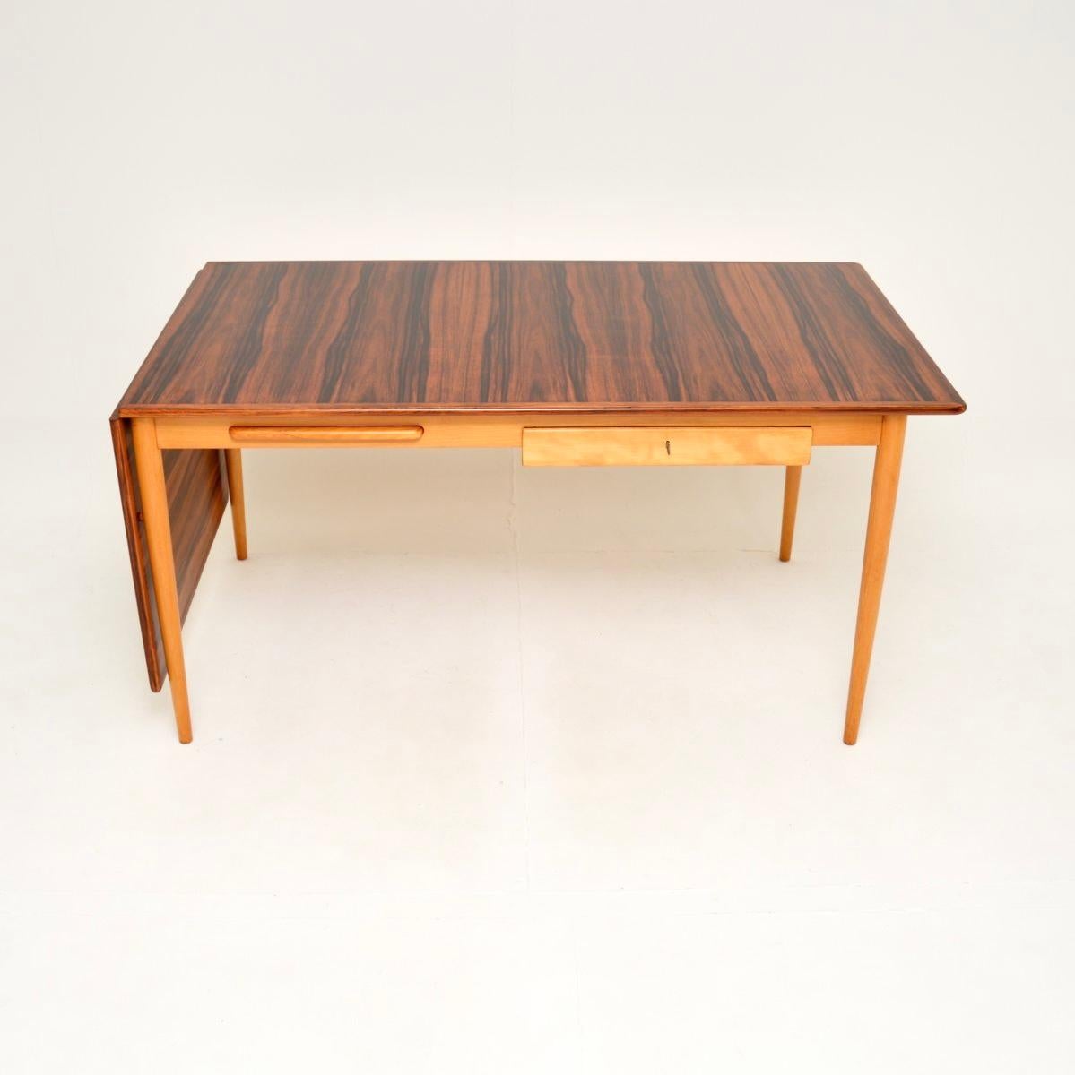 A stylish and very well made vintage Swedish sycamore drop leaf desk, dating from the 1960’s.

This is of amazing quality and has a wonderful design. It is large and impressive, with a drop down leaf that lifts up to extend the work space