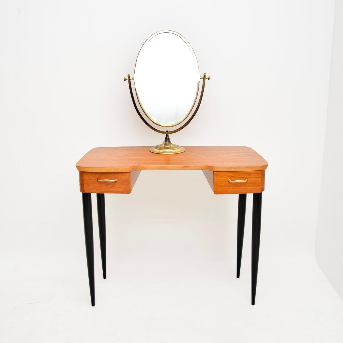 A very stylish and useful vintage Swedish teak desk / dressing table. We have recently imported this from Sweden, it dates from the 1960’s.

The quality is superb, this is beautifully designed and is a perfect size to be used as a small desk or as a