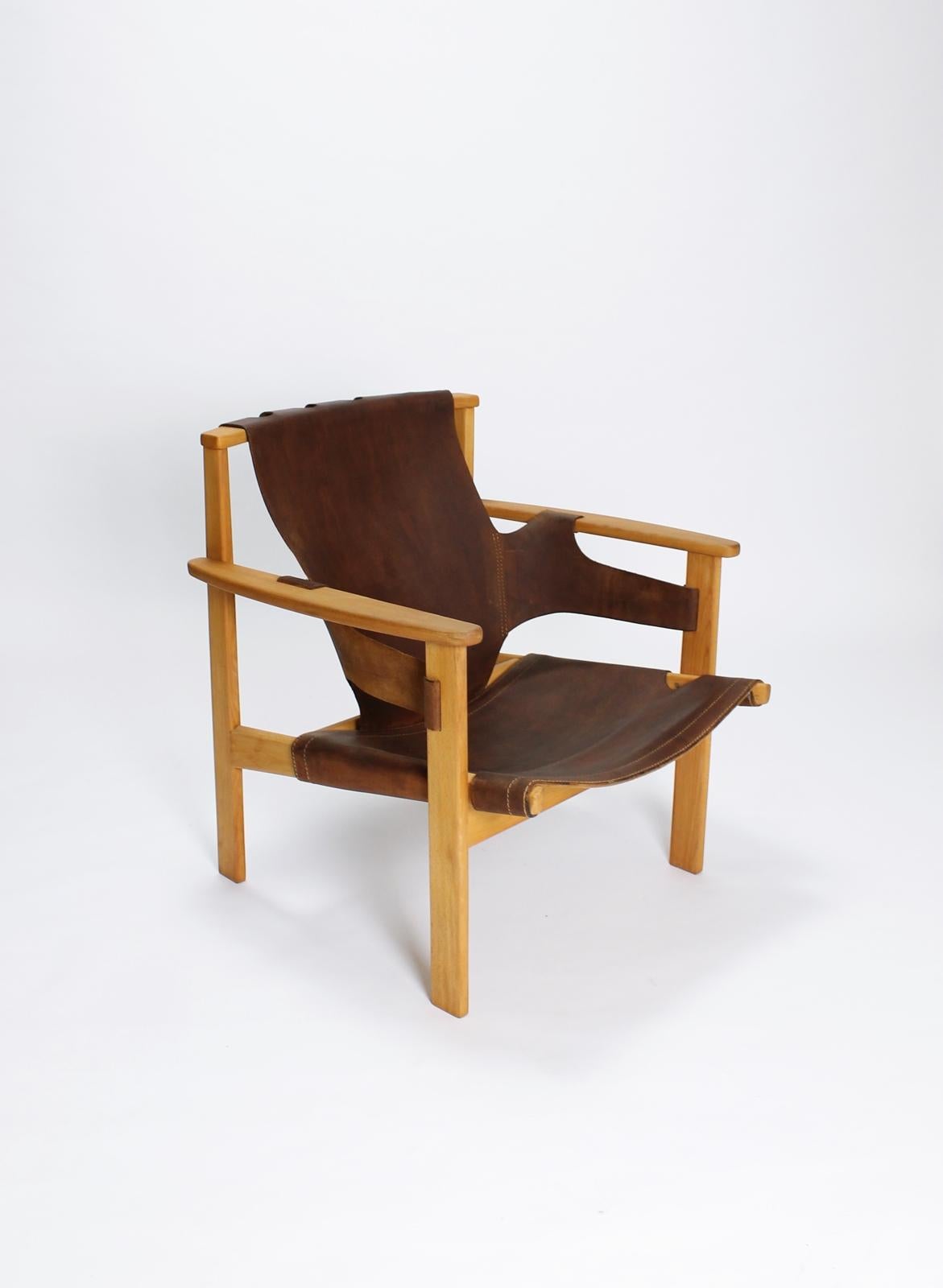 This midcentury classic vintage Swedish lounge chair was designed in 1957 by Carl-Axel Acking for Nordiska Kompaniet. Exhibited at the Triennale in Milan in 1957 and since then named 