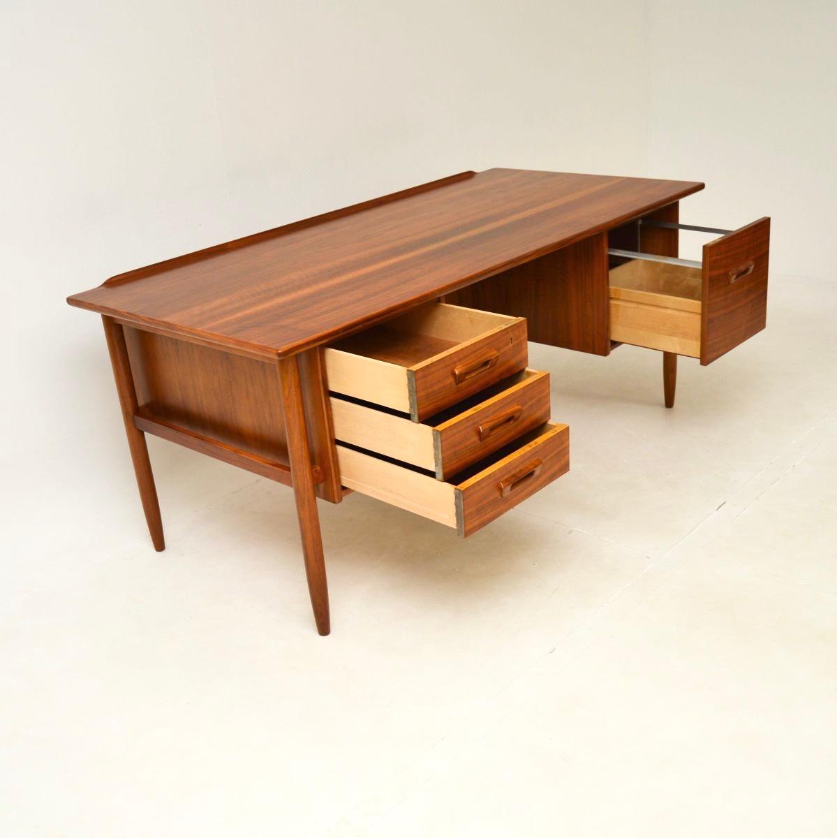 An absolutely stunning and extremely well made vintage Swedish walnut desk by Goran Strand for Lelangs Mobelfabrik. This was recently imported from Sweden, it dates from the 1960’s.

The quality is outstanding, this is a great size with lots of