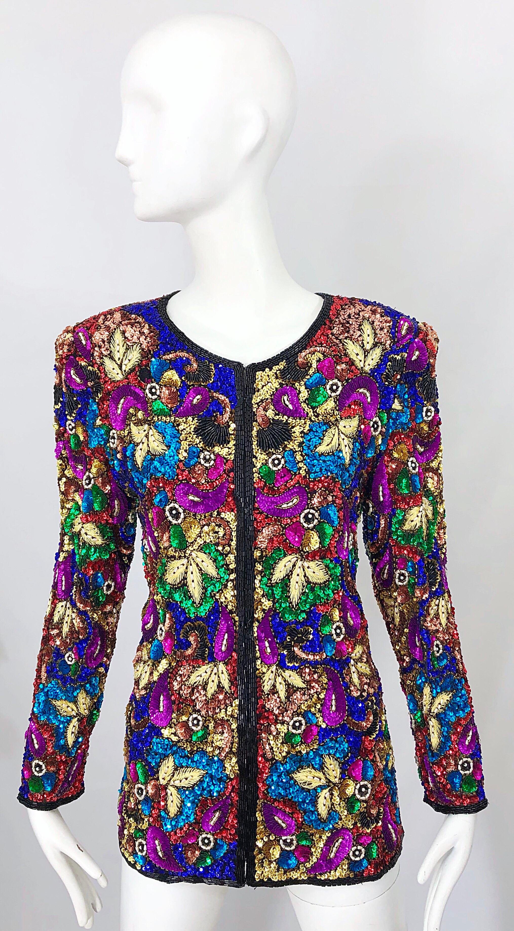 Wonderful vintage 90s SWEE LO fully sequined, beaded and pearl encrusted stained glass silk jacket! Features thousands of hand-sewn sequins, beads and pearls throughout. Hidden hook-and-eye closures up the front. Literally every color in the rainbow