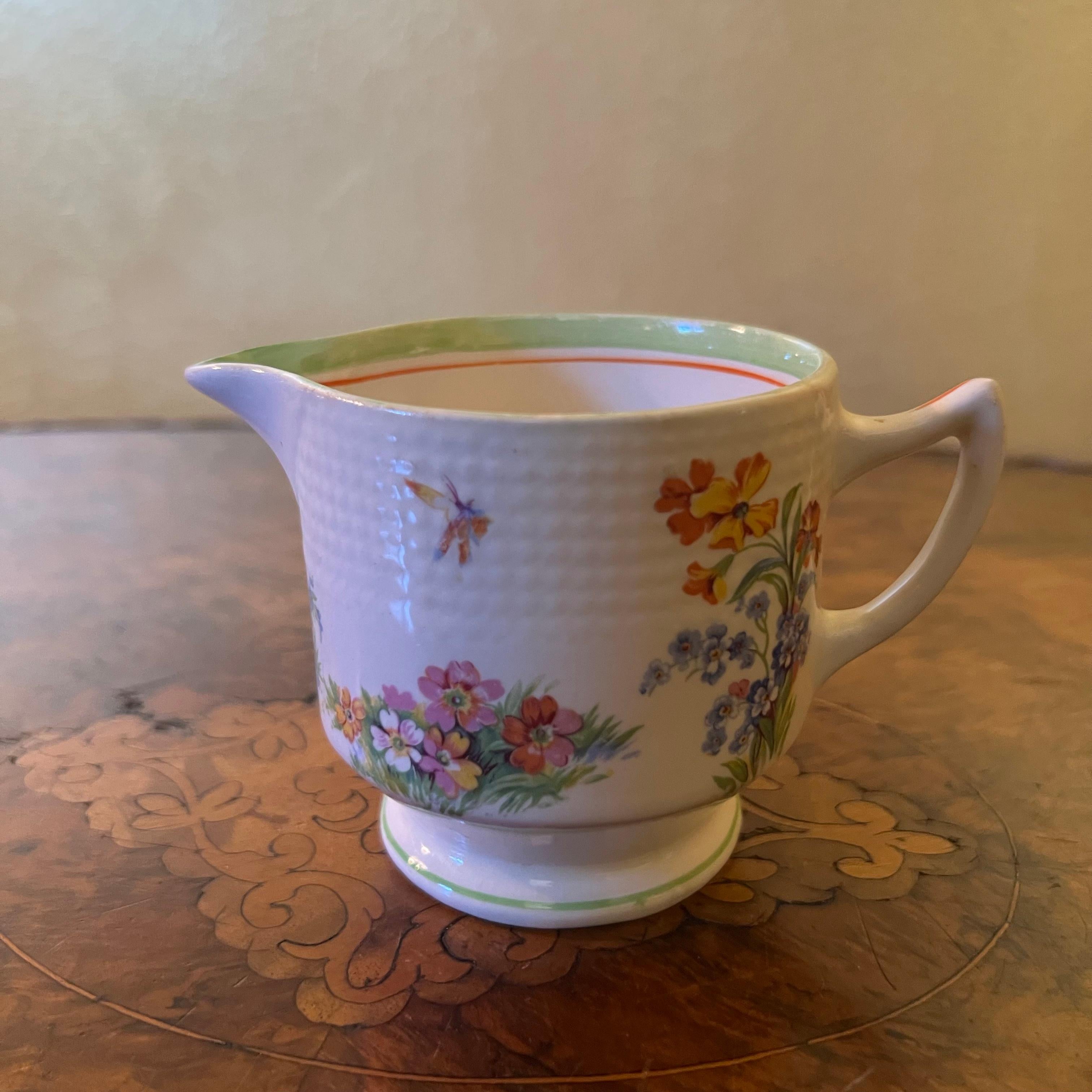 Description: Floral print with a butterfly print, some ware to print and staining to jug, stamped Swinnertons 

Material: Porcelain 

Country Of Origin: England   

Measurements: 8cm high, 12.5cm length, 7.5cm width 

All shipping comes with