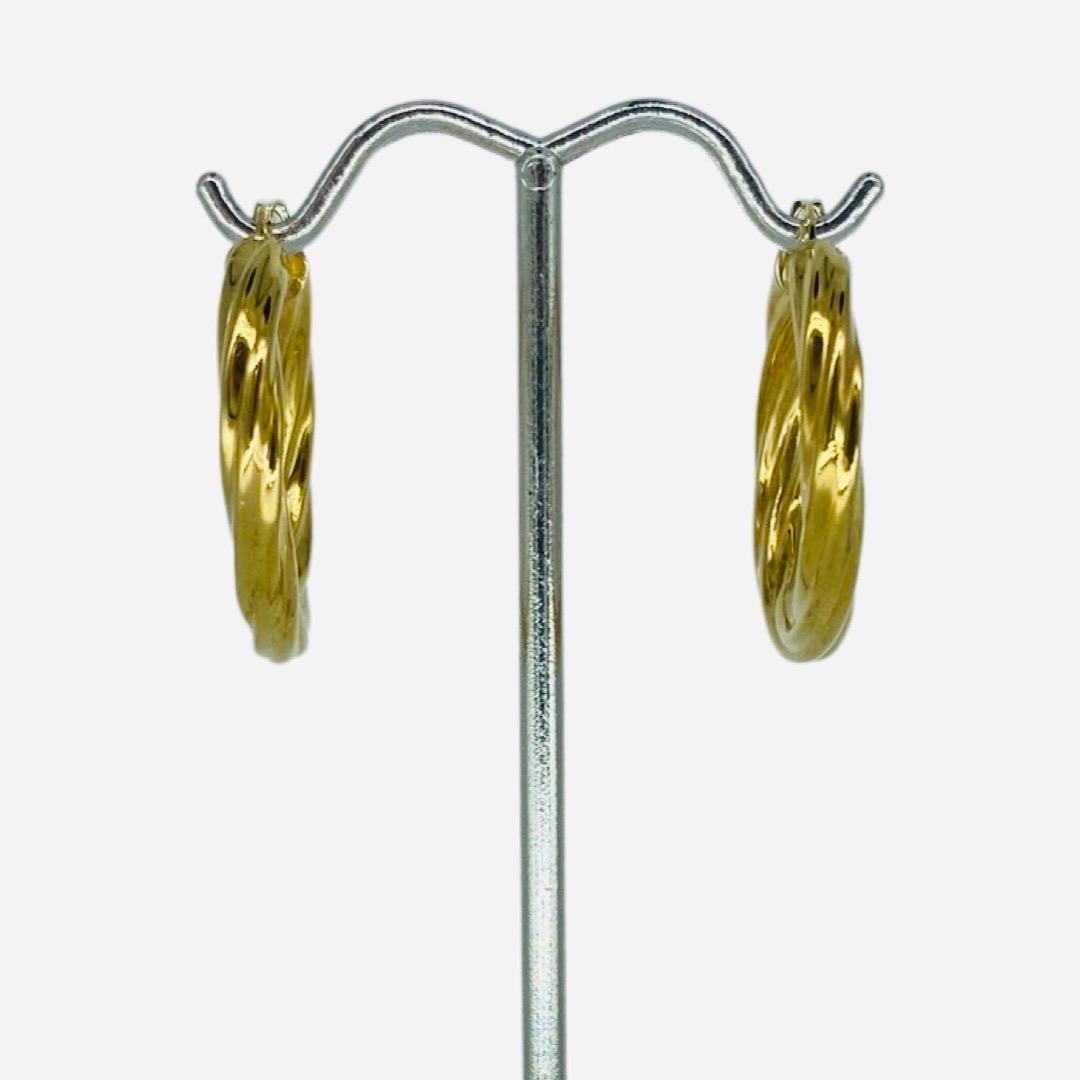 Vintage Swirl Design Italy 18 Karat Hoop Earrings. Beautiful earrings made in 18k gold. The earring's width is 4mm and diameter is 27.50mm. The earrings weight 5 grams and are stamped 750 for 18 karat gold purity percentage.