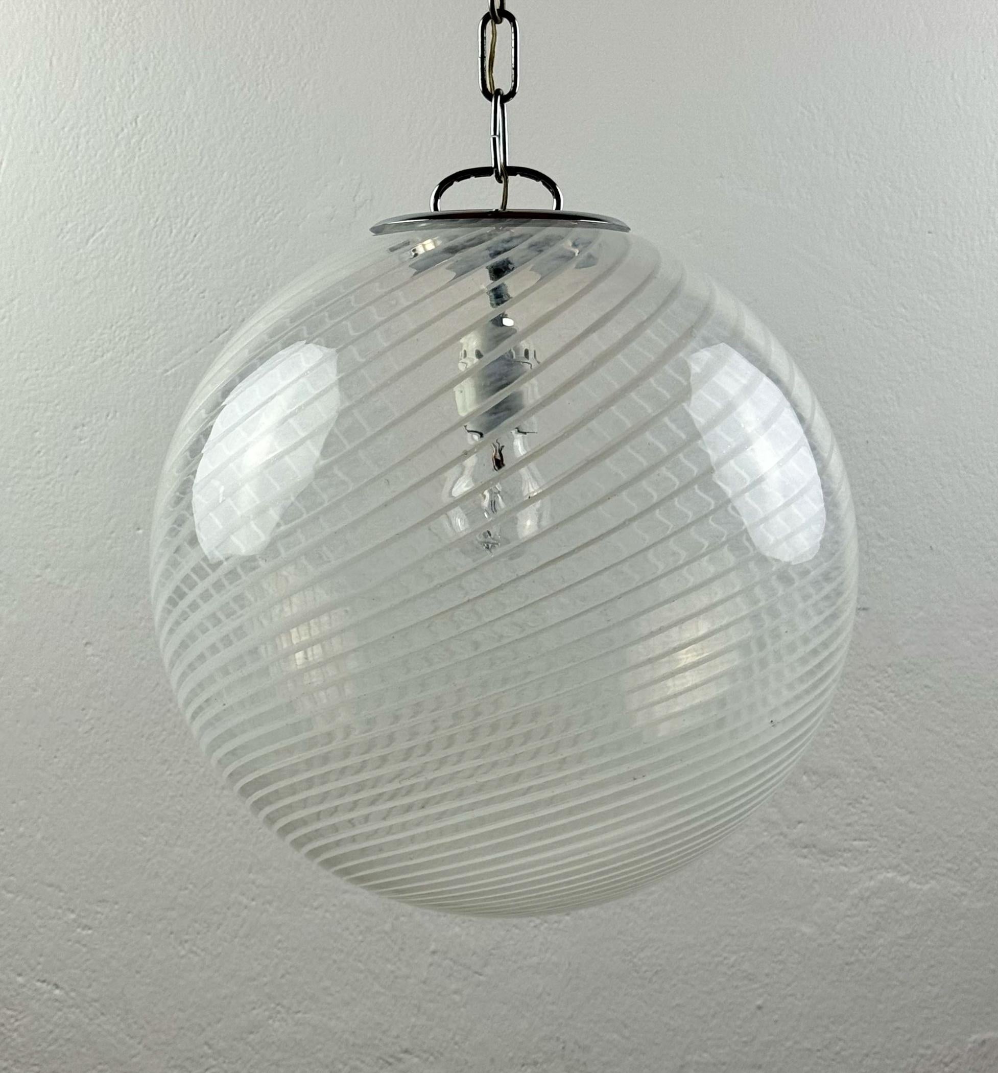 Beautiful original vintage Murano pendant lamp Ball made in Italy in the 1970s.

Good vintage condition. Wiring replaced.

Dimensions:
Width: 35 cm / 13.8 inches
Height: 37 cm / 14.6 inches
Lamp height with cable: 100 cm / 40 inches

Lamp requires