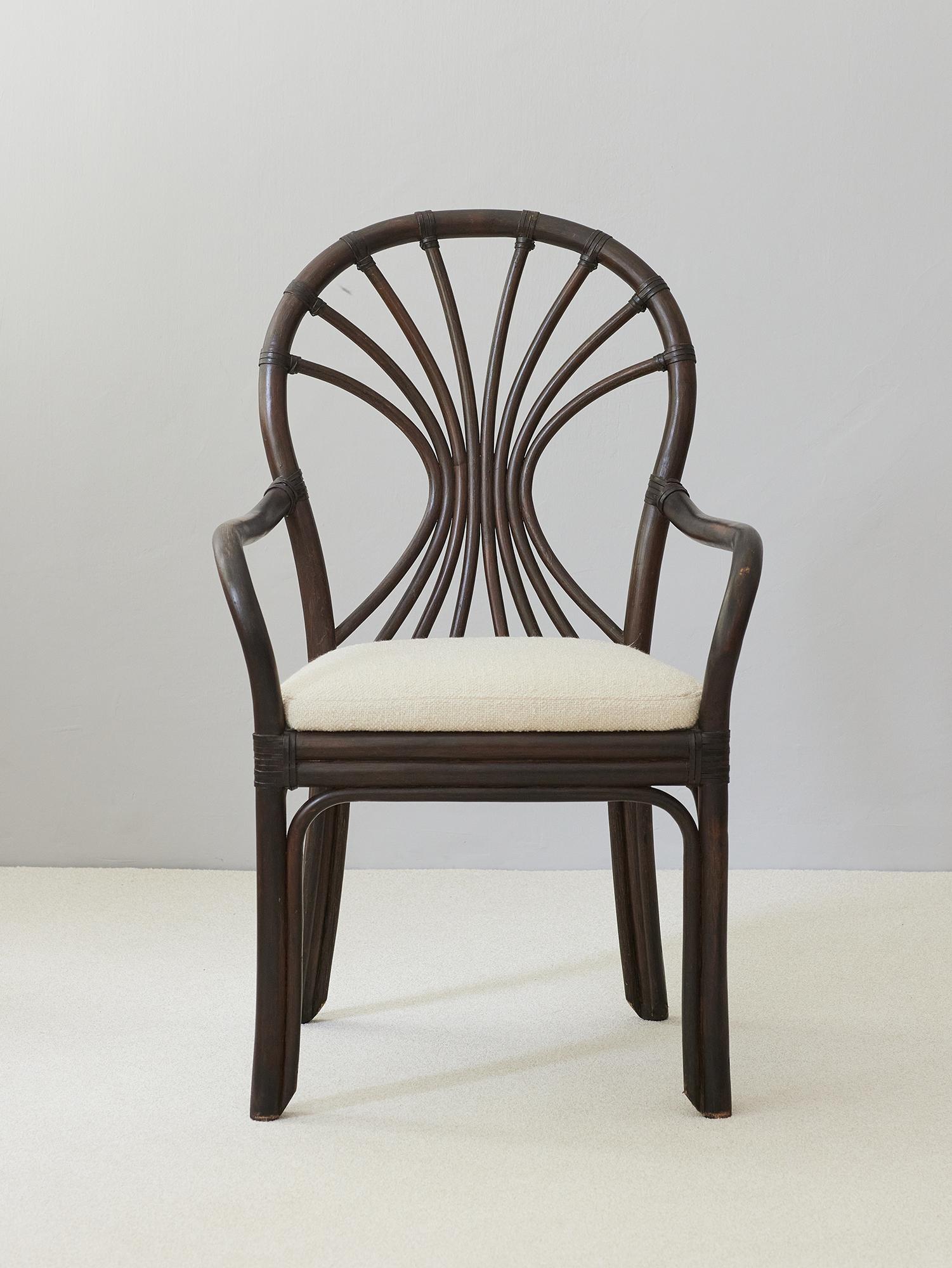This  handcrafted mid century  Swiss vintage organic modern bent rattan armchair made in the bistro cafe art nouveau style. Gracefully curved arms conjoined to a newly upholstered seat .
Wear consistent with age and use. Minor losses.