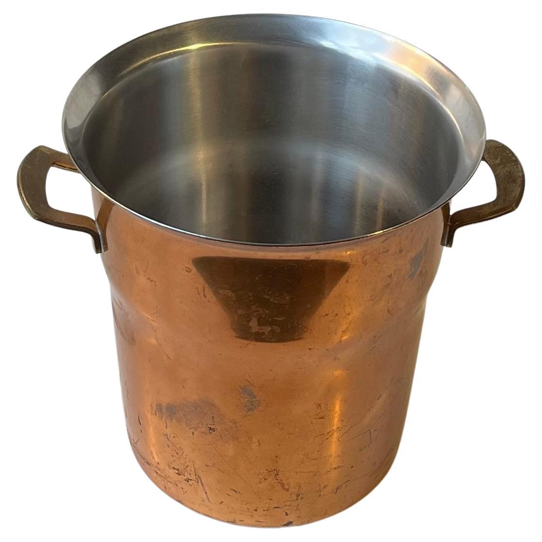 A wellmade champagne or wine cooler fashioned from solid copper and brass and linen with stainless steel for easy cleaning. Designed and made at Spring Culinox in Switzerland circa 1960s to 70s. Reminiscent in style and quality to Hagenauer and