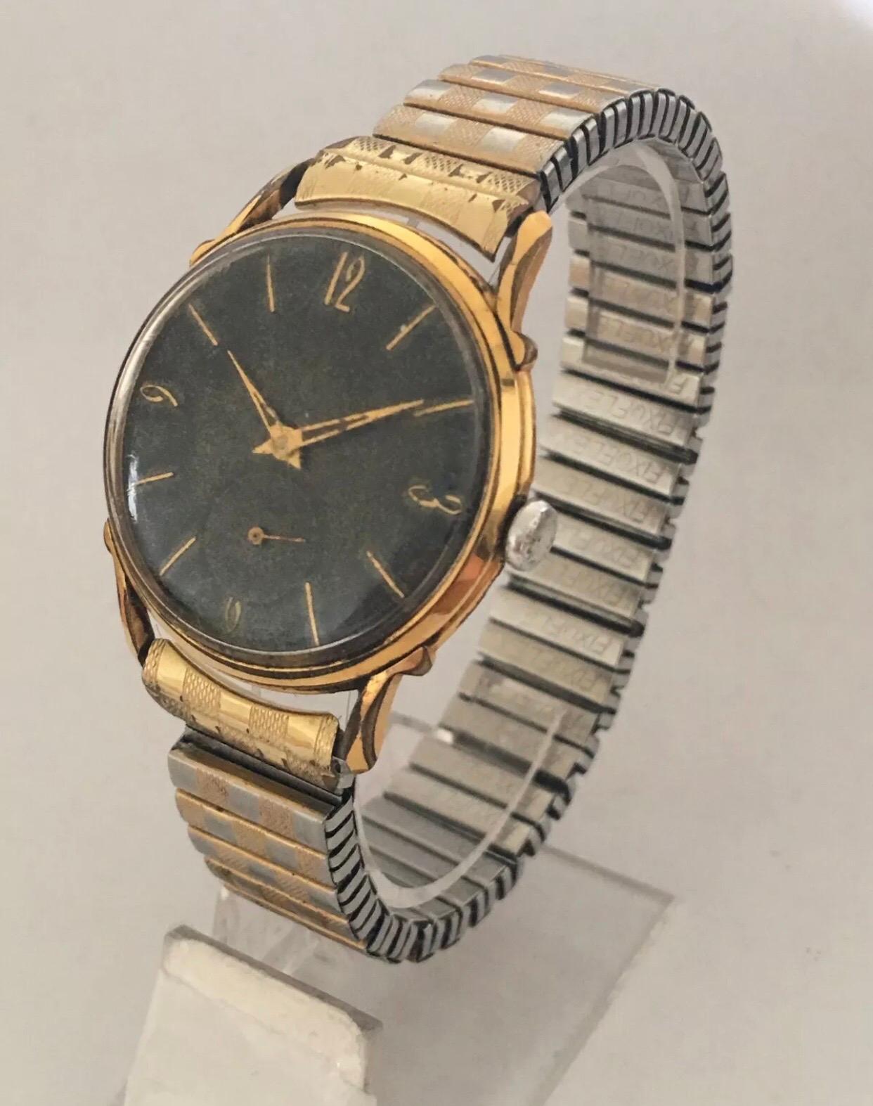 Handgeflügelte Schweizer Edelstahl-Armbanduhr mit schwarzem Zifferblatt, vergoldet im Angebot 6