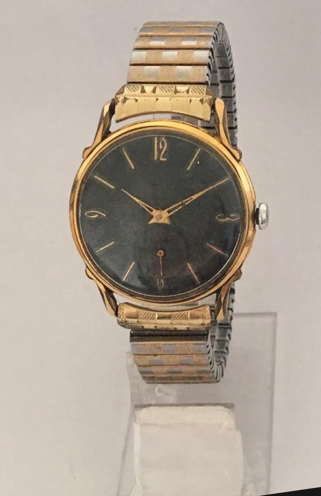 Handgeflügelte Schweizer Edelstahl-Armbanduhr mit schwarzem Zifferblatt, vergoldet im Angebot 7