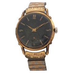Montre-bracelet suisse vintage à cadran pivotant à la main en acier inoxydable plaqué or et noir