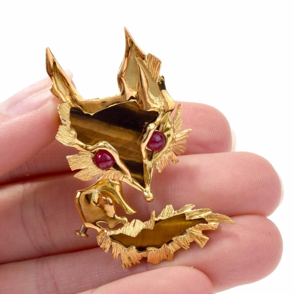 This captivating Vintage Fox pin brooch of avant-garde design depicting the head of a fox is meticulously hand-made in Barked finish textured 18 karat yellow gold, weighing 14.2 grams and measuring 1.80 inches long by 1.4 inch max. wide. The