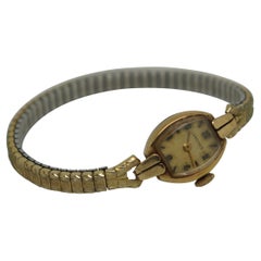 Longines Montre-bracelet suisse vintage en or 14 carats pour femme avec 17 rubis et bracelet en forme de spesselle
