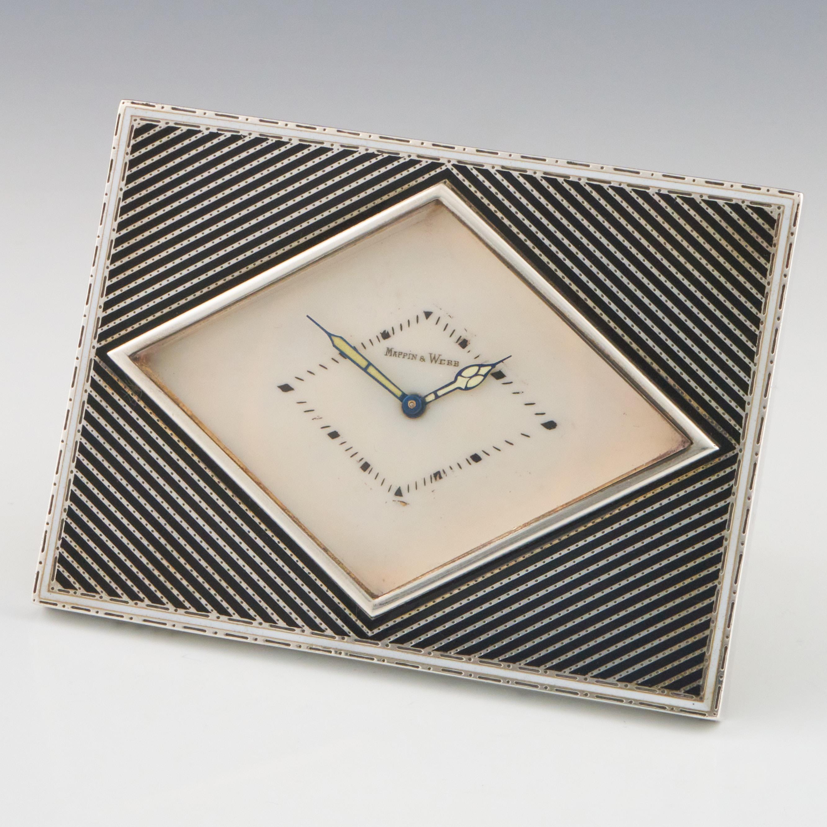 A rectangular silver niello Art Deco desk clock retailed by Mappin & Webb.