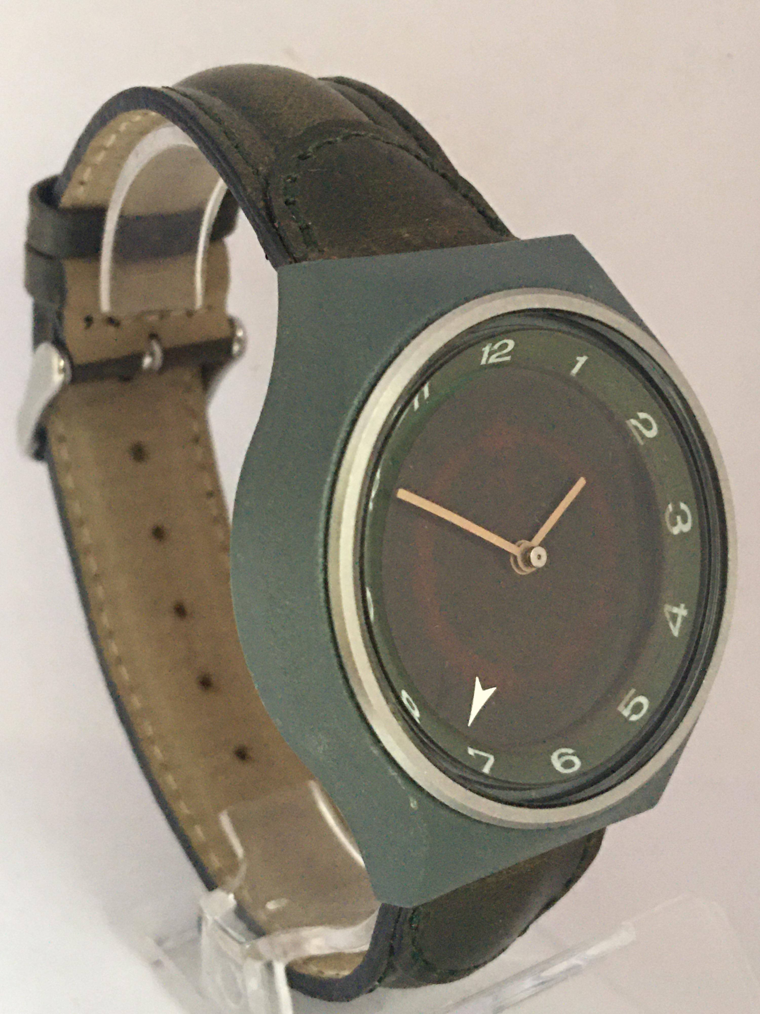 This beautiful vintage Swiss made hand winding watch is in good working condition and it is running well. (Keeps a good time.) Visible signs of ageing and wear with small light marks on the glass as shown. Its Noryl green case and fiber glass is in