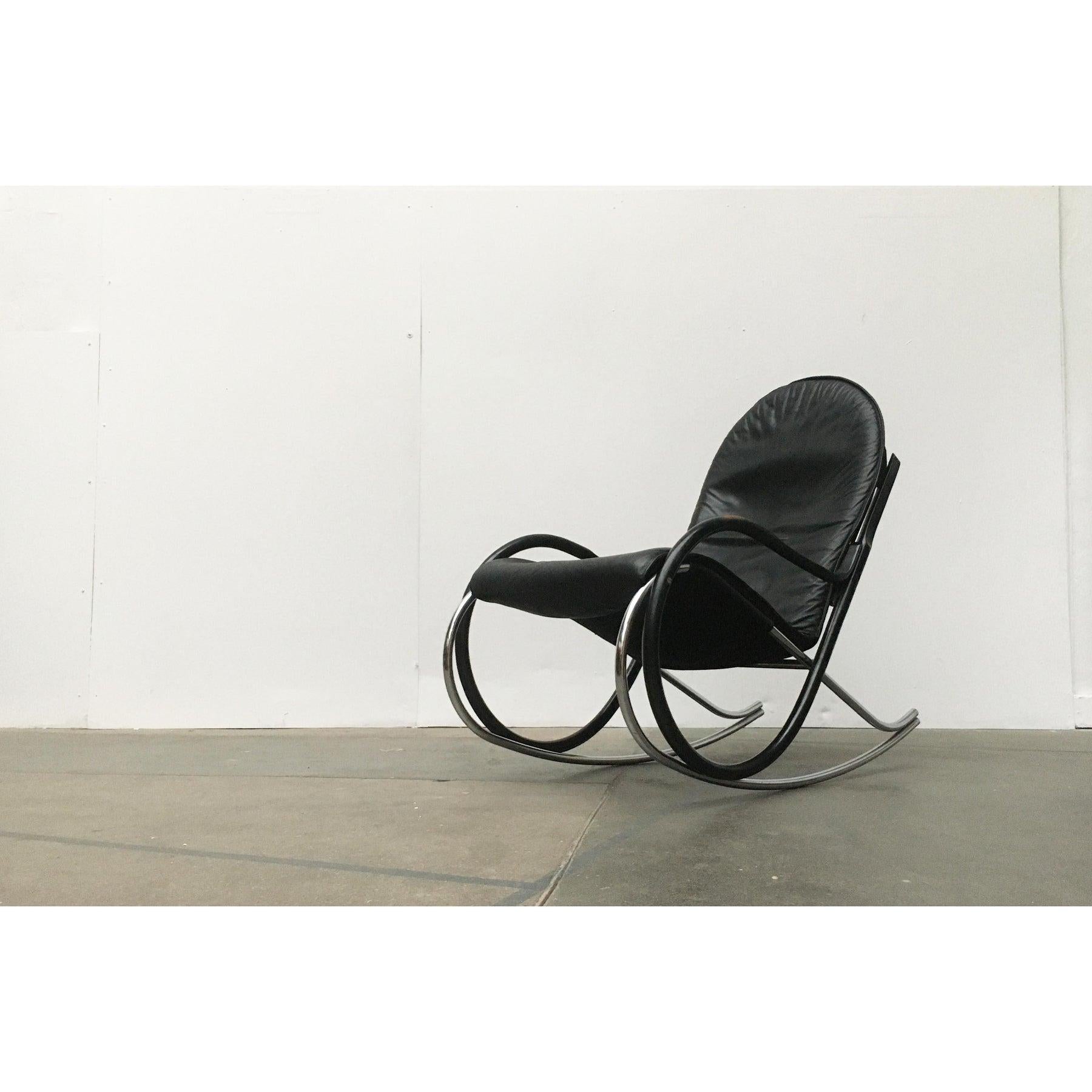 Elegant rocking chair from the Swiss manufacturer Strässle to a design by Paul Tuttle from the early 70s.This design combines the formal language of classical bentwood rocking chairs with a contemporary materiality. The frame is a hybrid of wood and