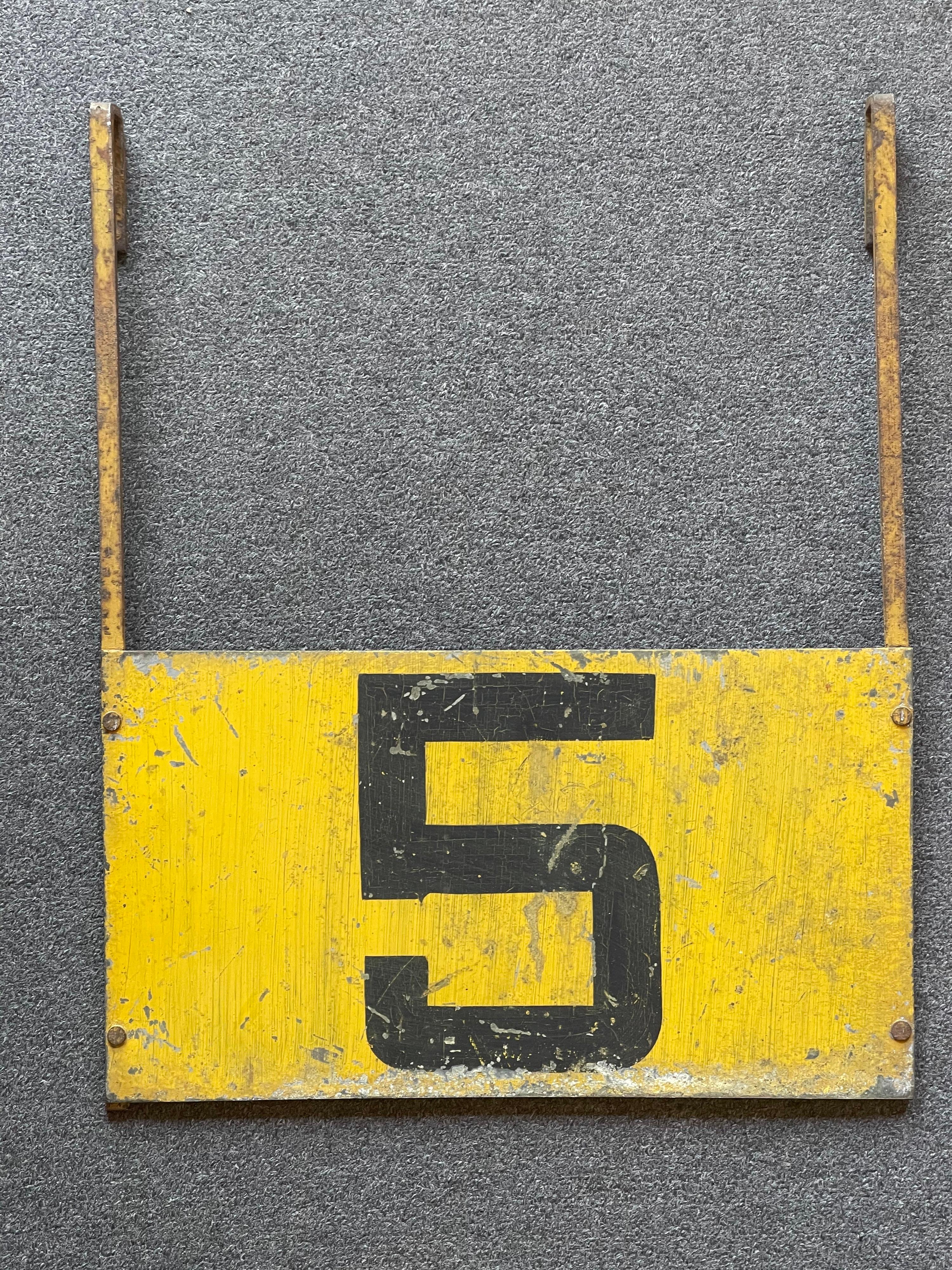 Super cool and hard to find vintage Swiss two sided train signal sign, circa 1940s. The sign is made of metal and painted yellow with the number 