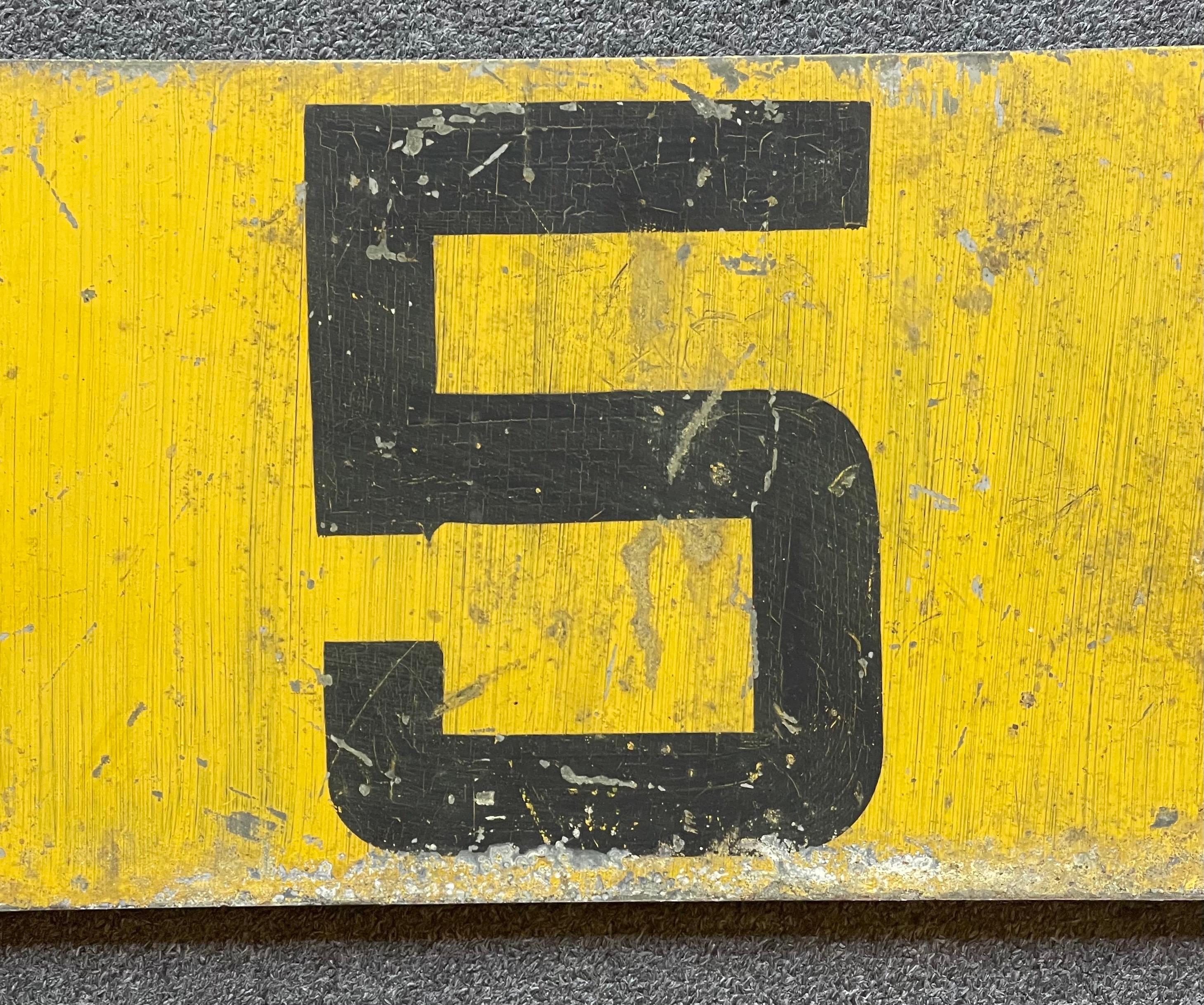 yellow 5 sided sign