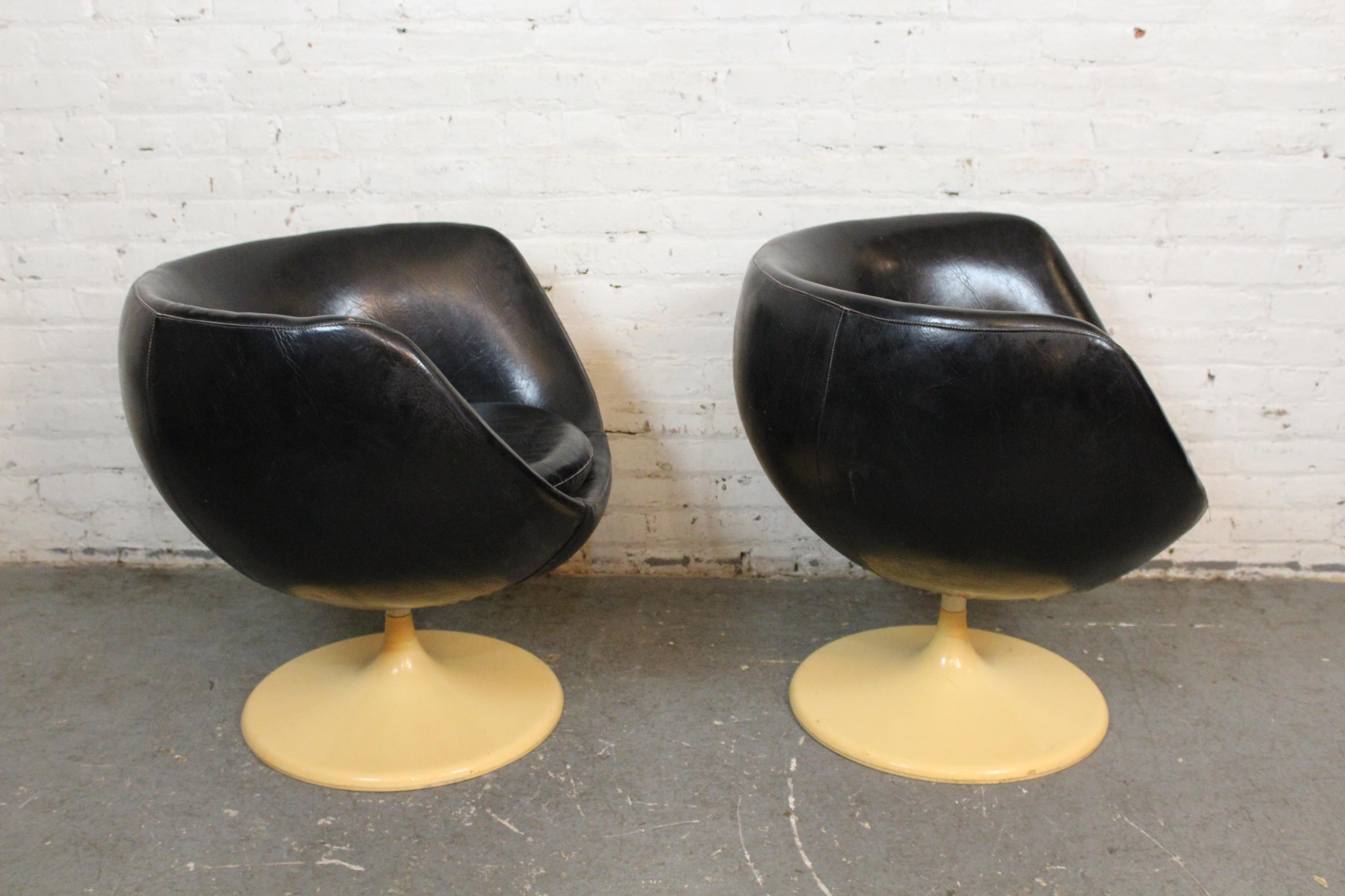 Take post-modern interior design for a spin with these funky goblet-shaped swivel chairs conceived by Italian designer Joe Colombo for West Germany's Lusch Erzeugnis chair company! This space-age pair features a comforting pod fully upholstered in